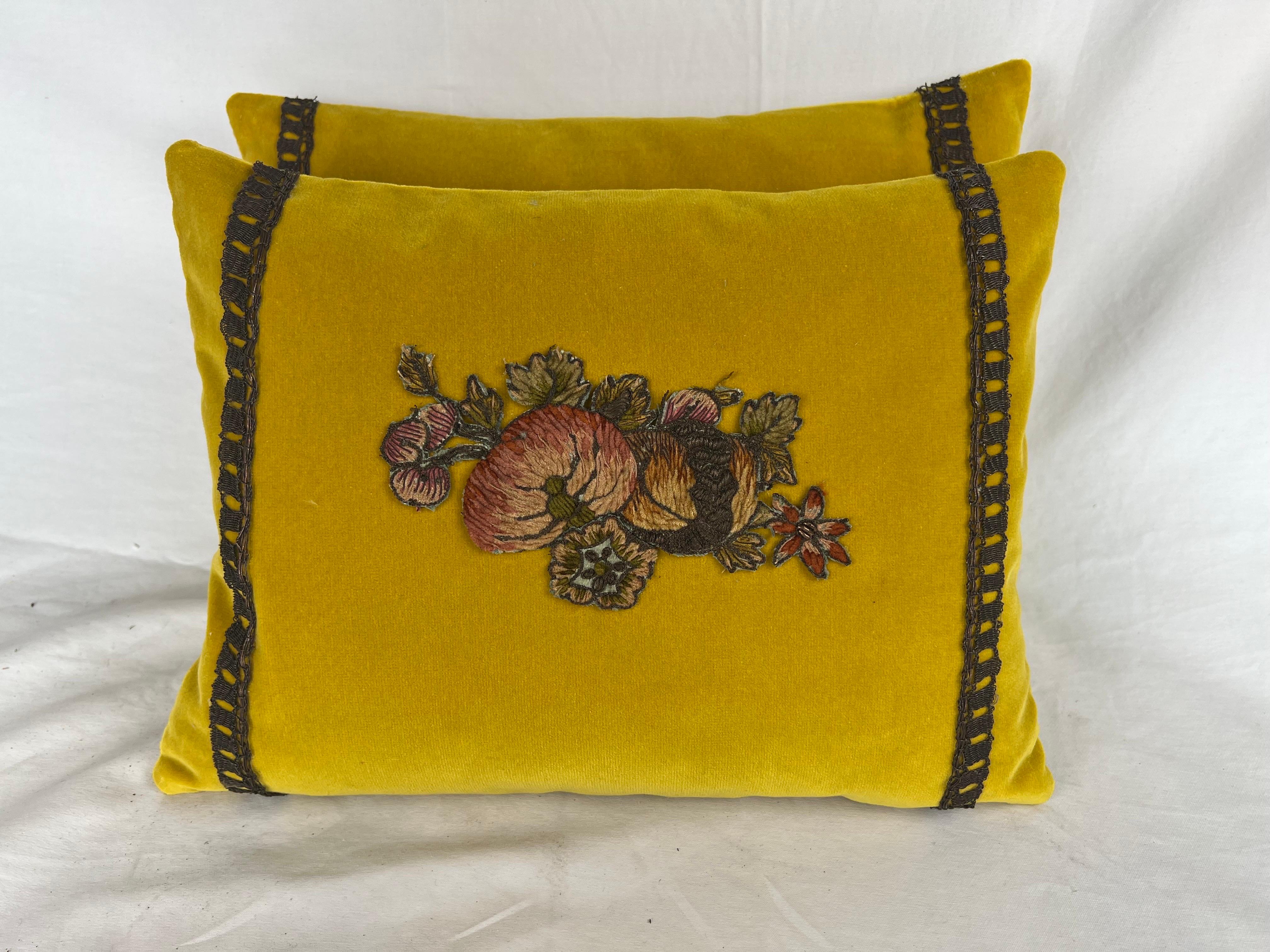 Pair of custom pillows made with 19th century French metallic & chenille floral appliques. The appliques were placed on a vibrant yellow mohair and finished with 19th century metallic handmade lace. Down inserts, zipper closures.