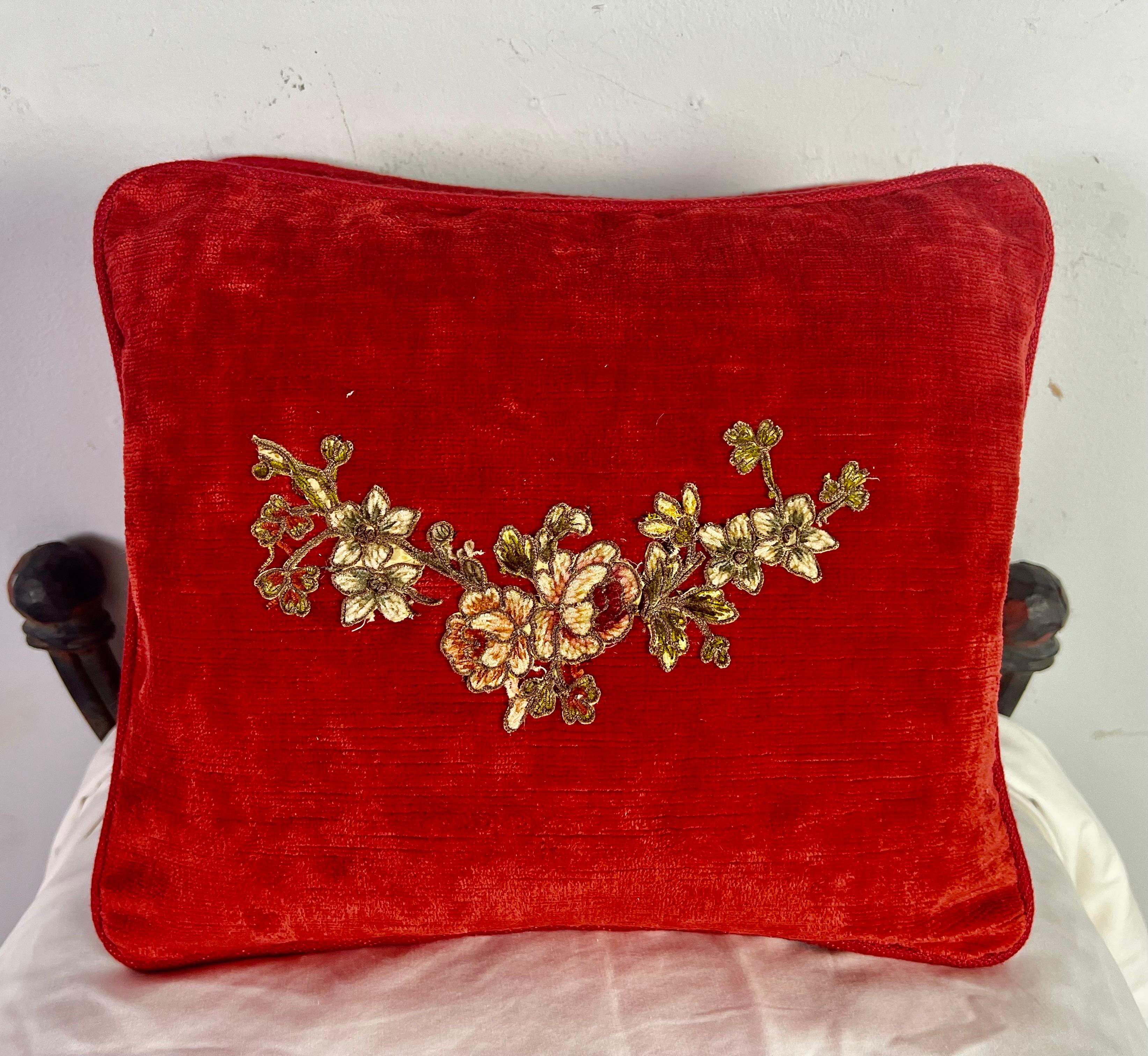 Custom pillows made with 19th century handmade metallic & chenille appliques. The appliques were combined with red velvet. Down inserts.