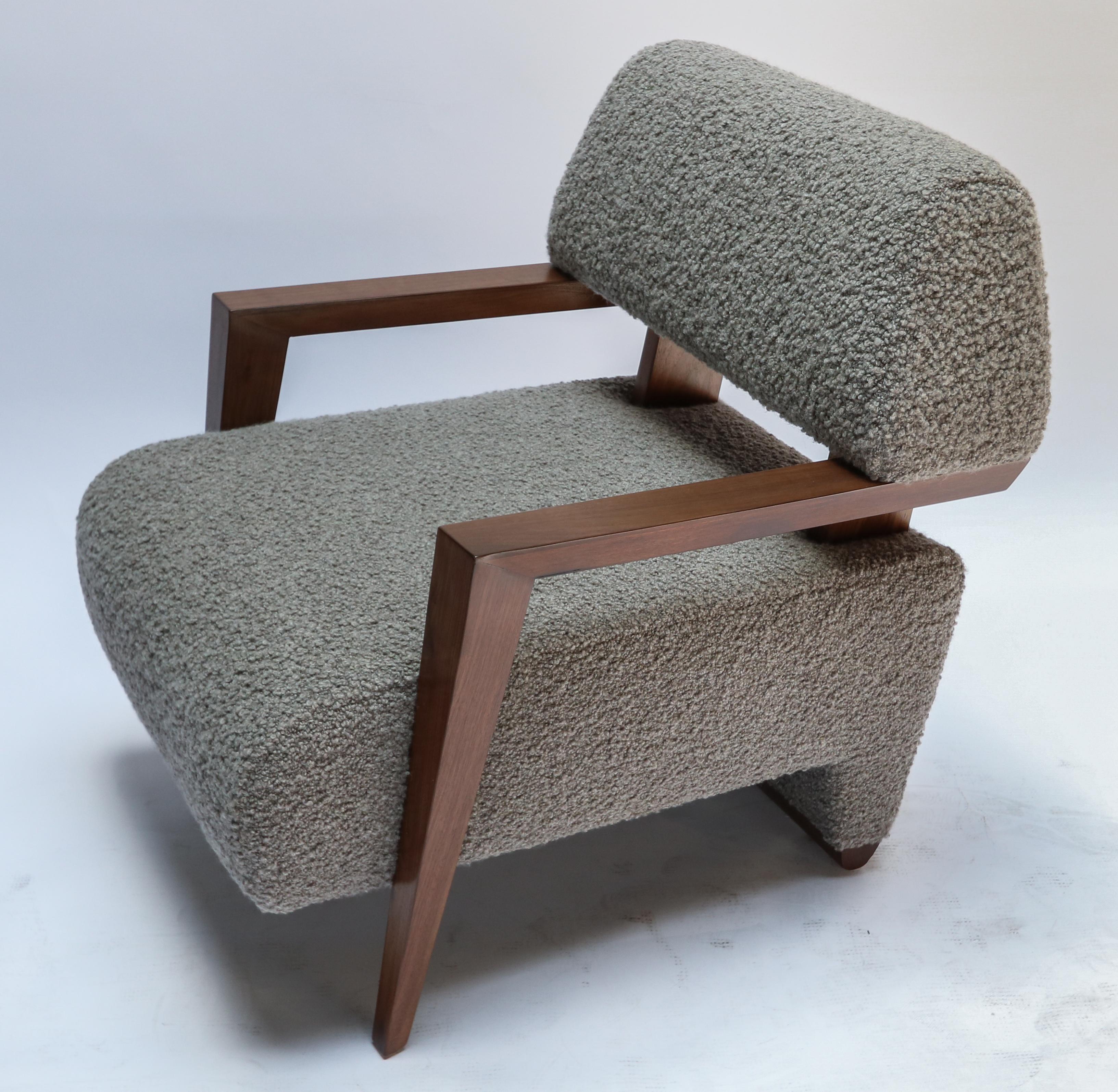 Pair of custom Art Deco mid century style American walnut armchairs upholstered in grey alpaca bouclé.  Made in Los Angeles by Adesso Imports. Can be done in different wood and fabrics.