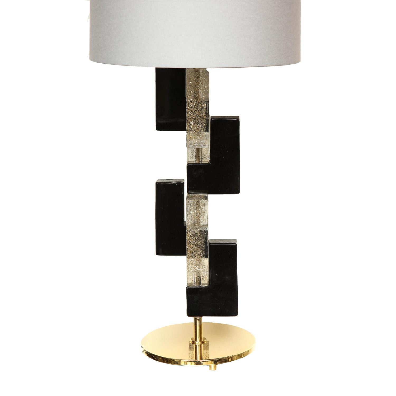 Stunning pair of Murano black and clear glass block table lamps with gold leaf inclusions and polished brass finish. Italy, 2021