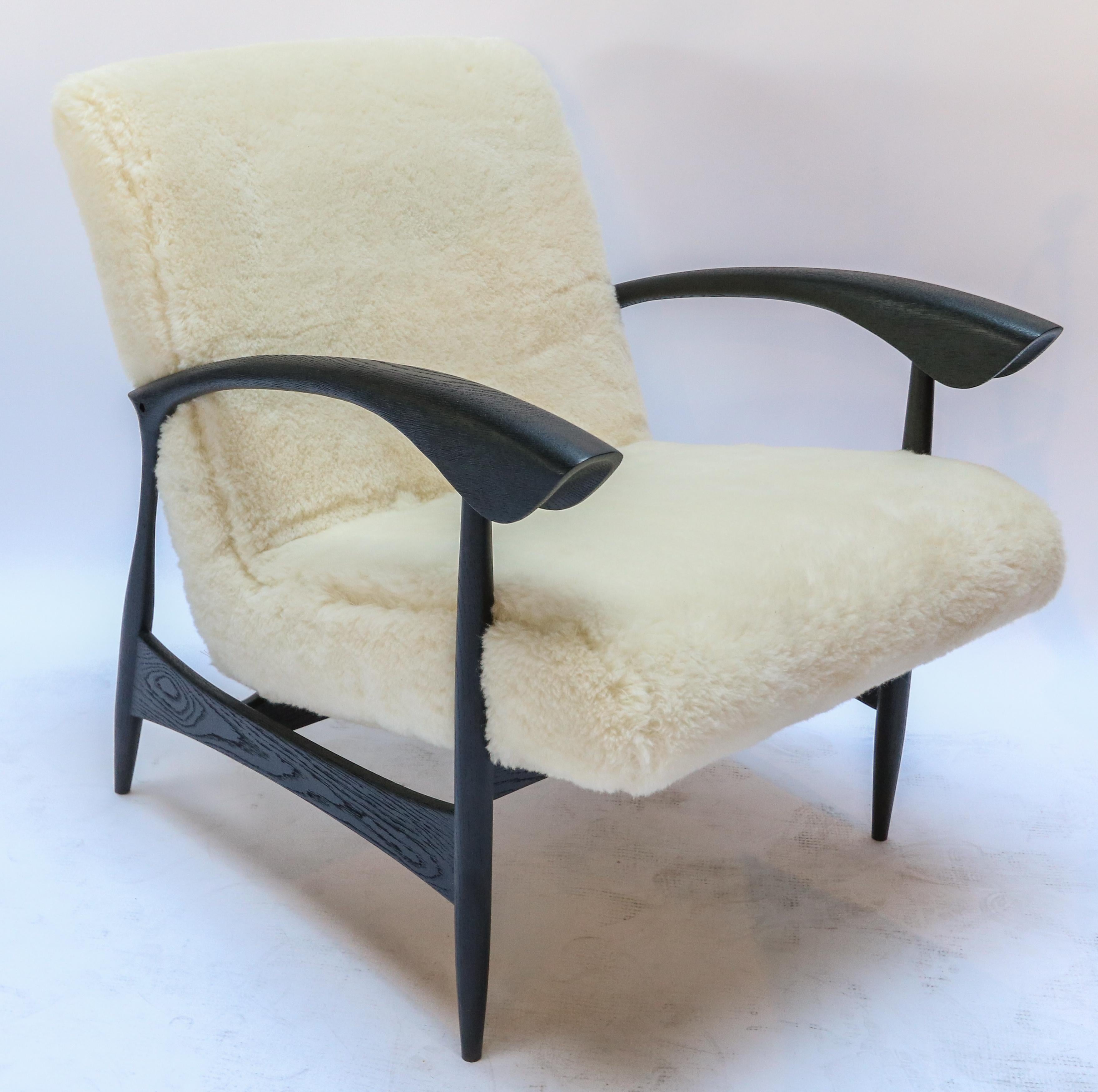 Pair of custom armchairs in black matte American oak and Italian ivory wool.  Made in Los Angeles by Adesso Imports. Can be done in different woods, finishes and fabrics.