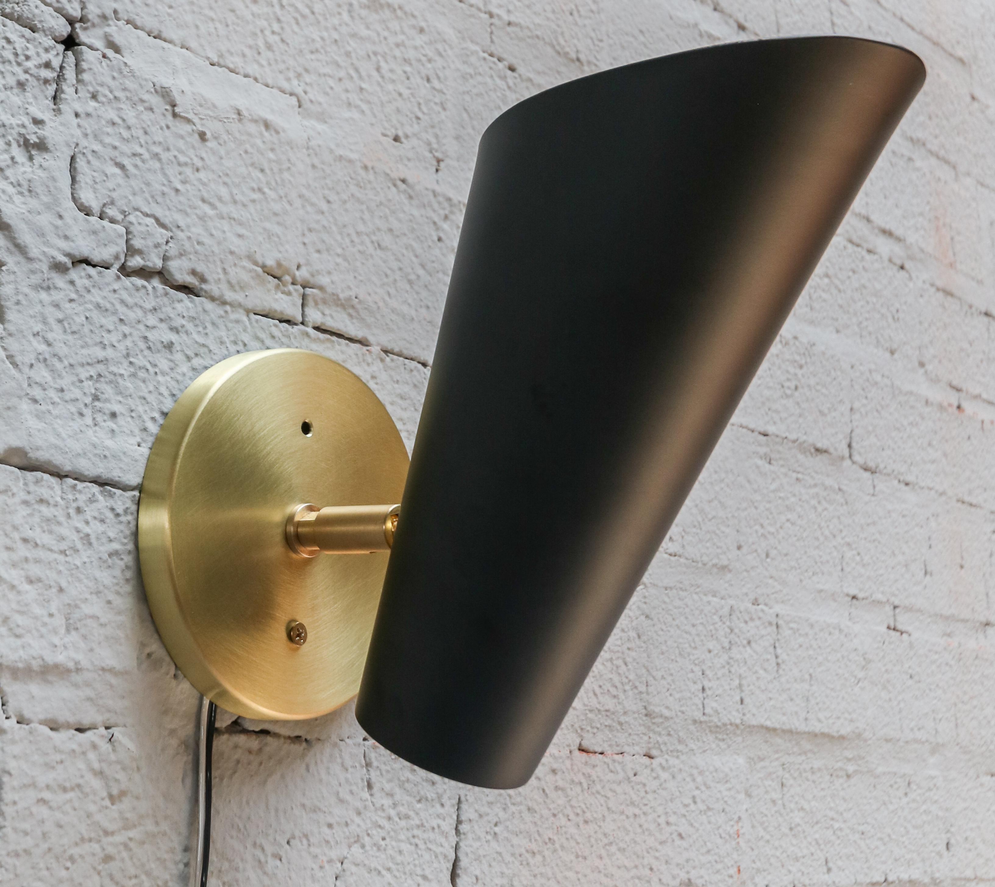 Pair of custom brass & black metal cone midcentury style sconces by Adesso Imports. Can be hung facing up or down and be angled or straight. Can be done in different metals.