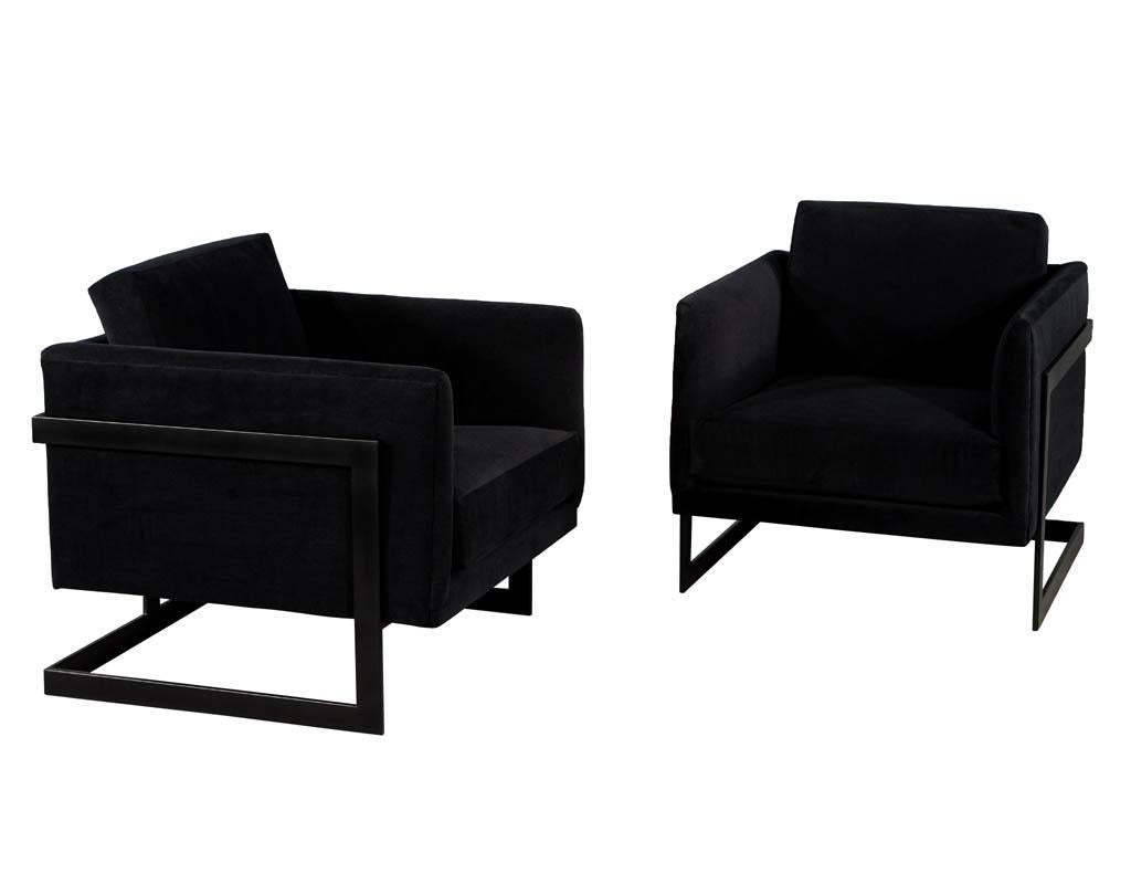Pair of custom black velvet lounge chairs with black metal frames by Carrocel. Design inspired by Milo Baughman, newly made here in Canada. Upholstered in a designer black velvet and complemented with a satin powered black metal frame. These chairs