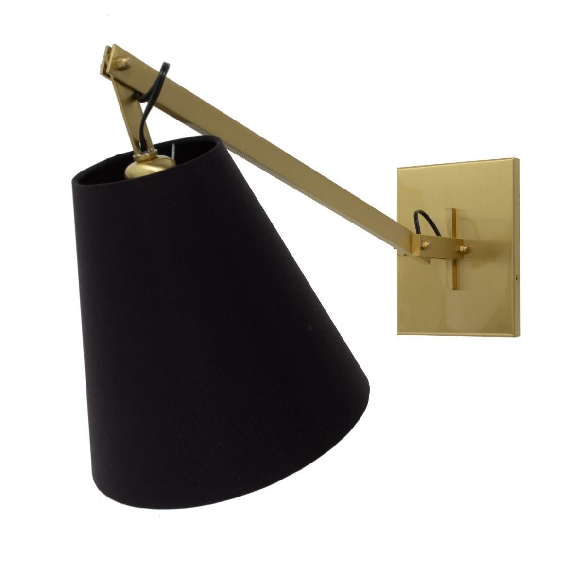 A pair of darkened brass wall lamps / sconces with black linen shades. 

Wired for US; each light takes a standard US bulb, 60 watts max.

Dimensions: 6.5