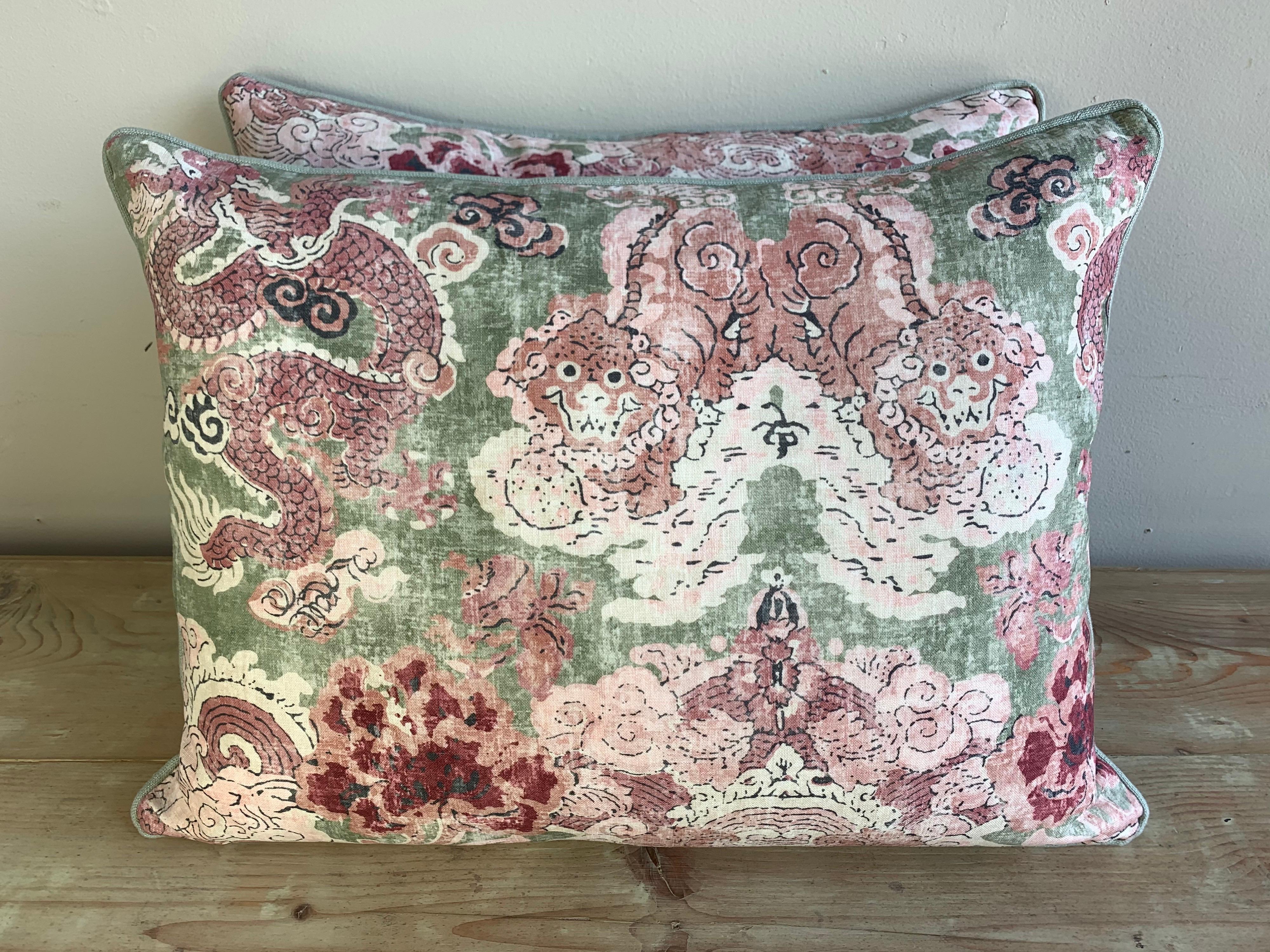 Pair of custom pillows made with a printed chinoiserie cotton front and a coordinating green back and self welt detail. Down inserts, sewn shut.