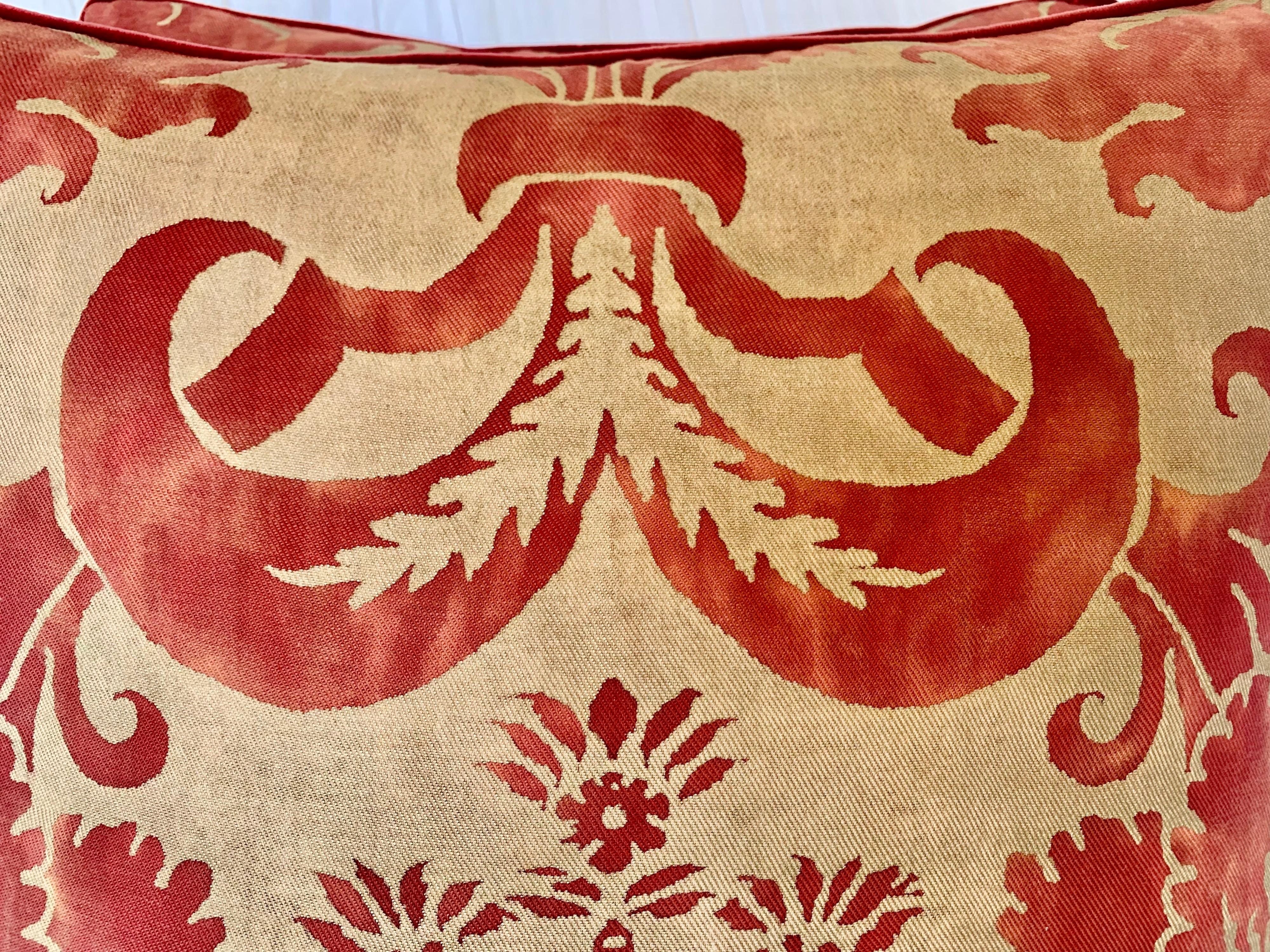 Pair of custom pillows made with vintage red/pink & gold metallic Fortuny fronts in the Gllicine pattern. The pillows have velvet backs that coordinate with the Fortuny fronts. Down inserts, sewn closed.