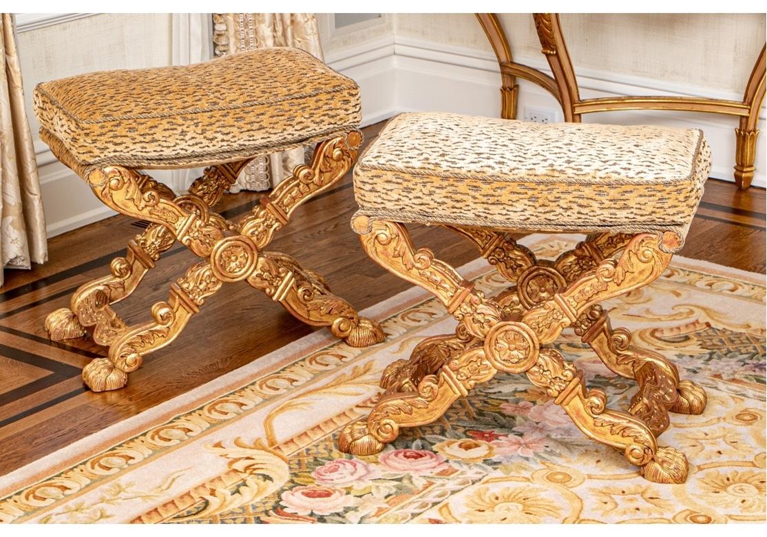 Pair of Louis XIV style X-shaped carved benches in gold, upholstered in cut velour 