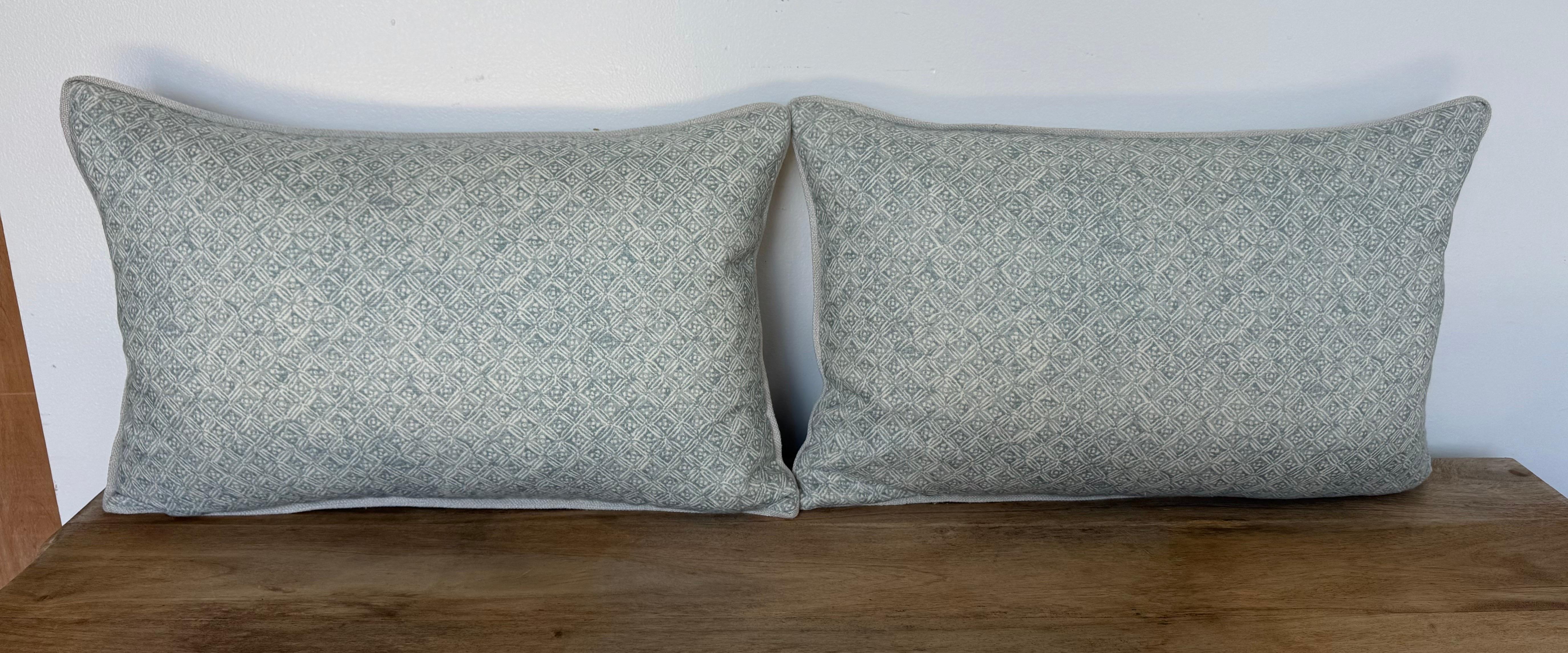 An elegant pair of custom pillows designed by Melissa Levinson, crafted from beautifully printed linen by Twigs. The fabric features a soft, geometric diamond lattice motif in muted tones of celadon and ivory, creating a look that is both timeless