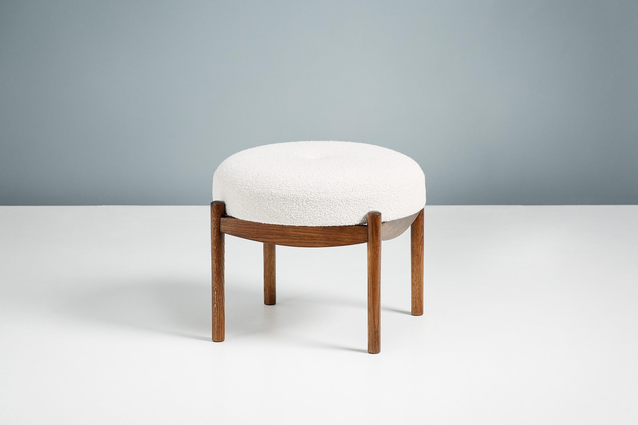 Dagmar Design

Blek Ottoman

A custom-made round ottoman with solid wood frame developed & produced at our workshops in London. These examples have frames in fumed oak with seats upholstered in off-white boucle. 

Blek is available to order in