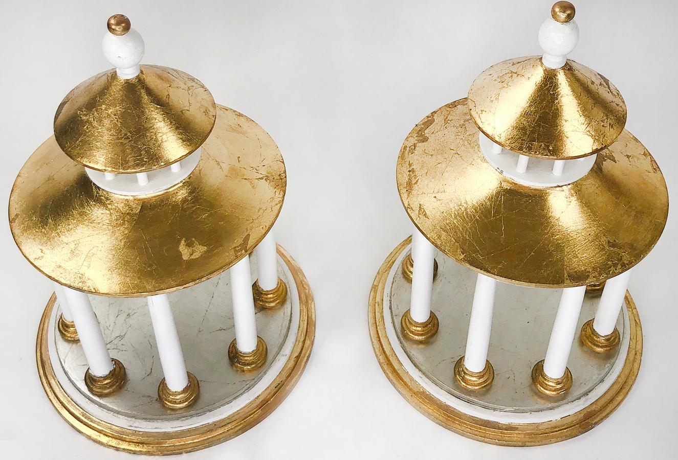 A pair of custom made hand-gilt classical pagoda models. Hand painted white columns and minor trim features. The roof, top, and lower floors of the model have a wonderful hand gilt sheen. In a couple different types of gold. Originally created for