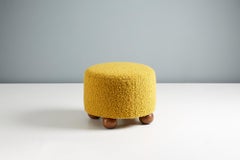Pair of Custom Made Round Boucle Ottomans with Oak Ball Feet