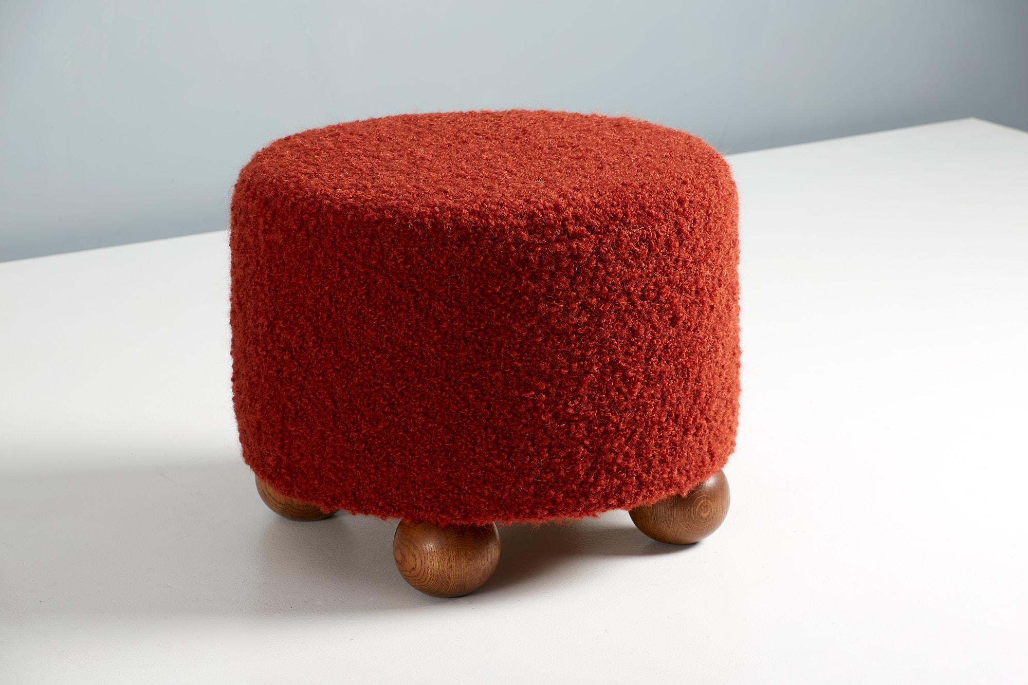 Dagmar Design - Round Ottoman.

Custom-made ottomans developed & produced at our workshops in London using the highest quality materials. These examples are upholstered in Pierre Frey OPIO boucle fabric in a vivid, deep red. The distinctive ball