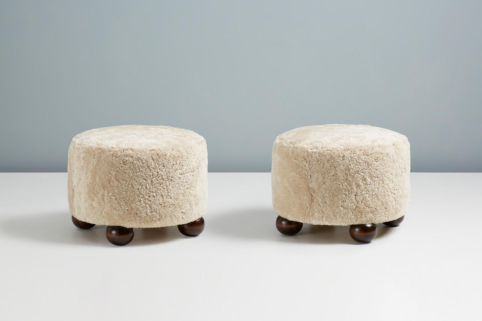 Pair of Custom Made Round Sheepskin Ottomans with Dark Ball Feet In New Condition For Sale In London, GB