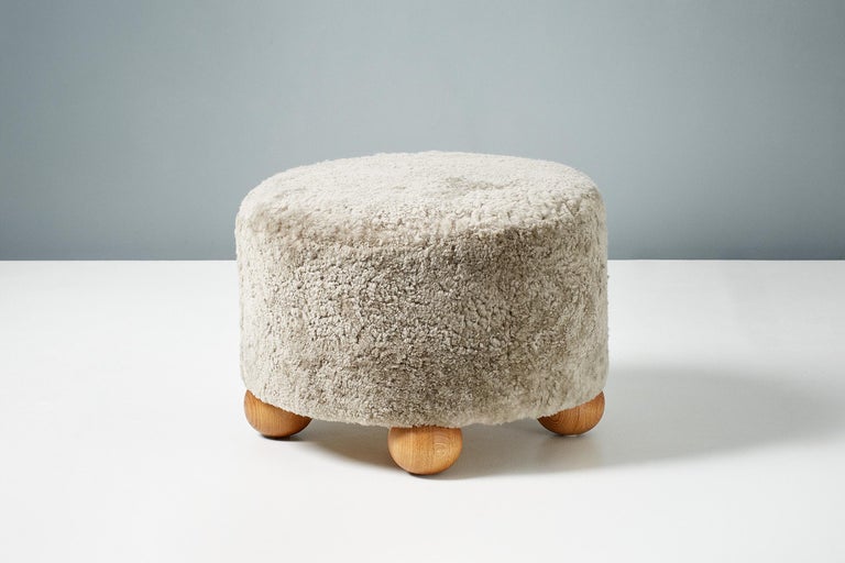 British Pair of Custom Made Round Sheepskin Ottomans with Oak Ball Feet For Sale
