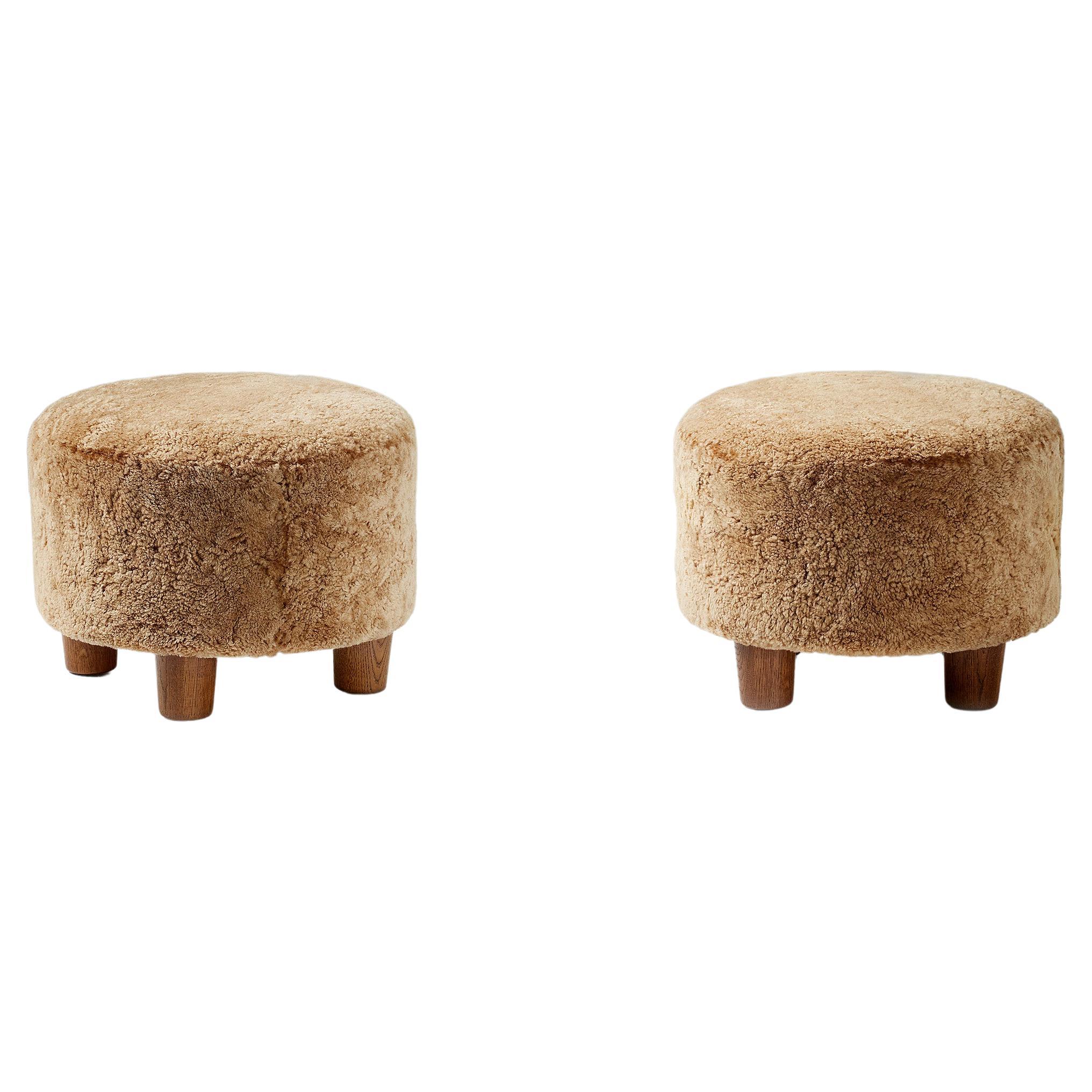 Custom-made ottomans developed & produced at our workshops in London using the highest quality materials. These examples are upholstered in a 'Maple' sheepskin and feature oiled and fumed oak feet.

A range of other sheepskin, fabric and wood
