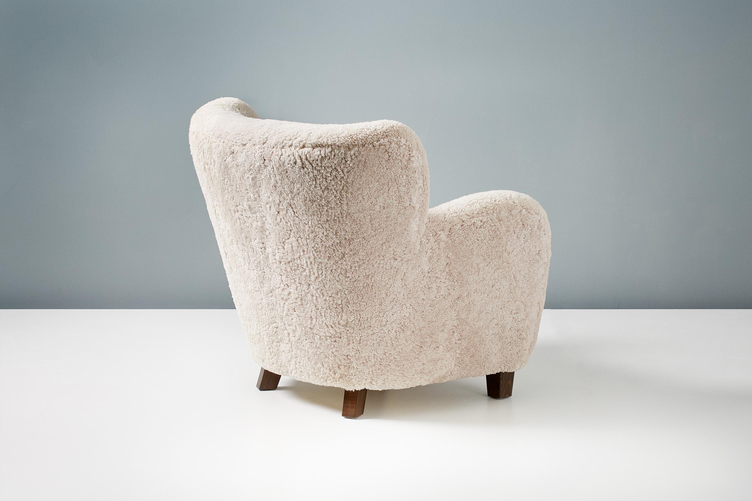Contemporary Pair of Custom Made Sheepskin Armchairs and Round Ottoman