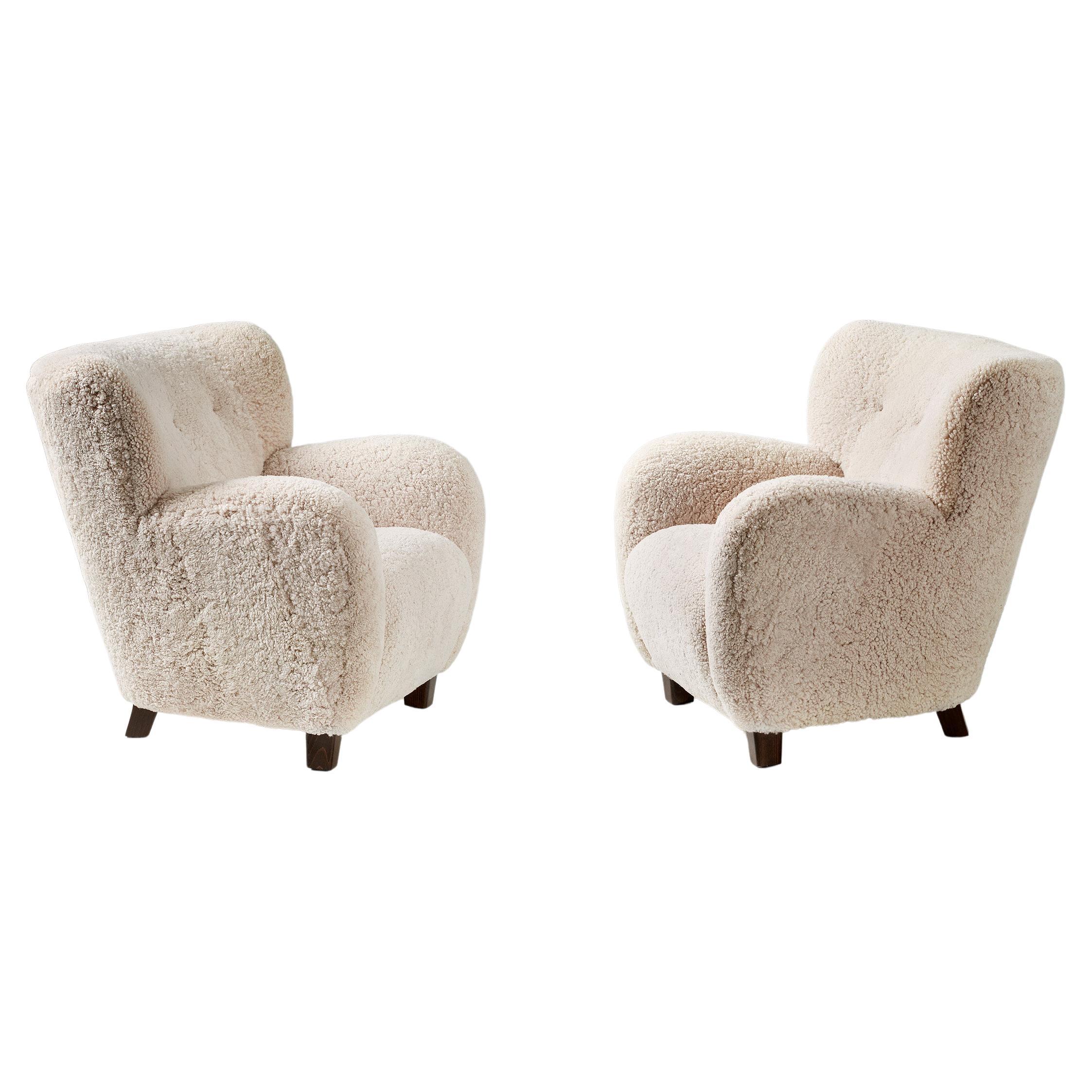 Pair of Custom Made Sheepskin Armchairs and Round Ottoman