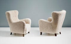 Pair of Custom Made Sheepskin Wing Chairs & Ottomans