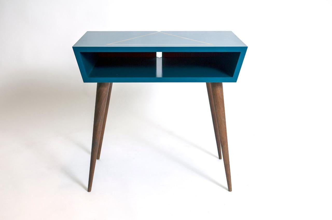 Elegant and unique pair of nightstands, custom made in California nicely blue lacquer case with gold leaf accent design on top solid walnut tapered legs with V-top on the back for lamp cord, solid and sturdy great quality one of a kind piece.
