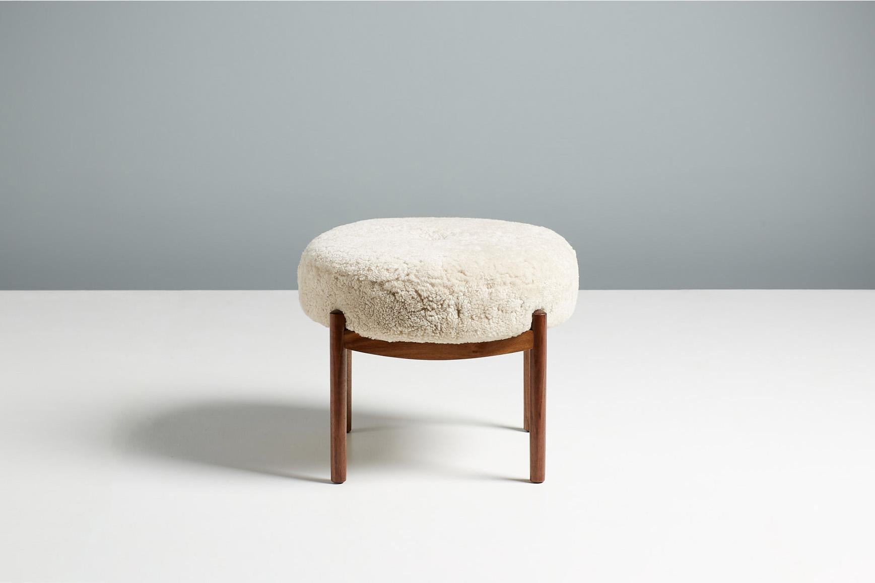 Custom Made Esko Ottoman from Dagmar Design

A pair of custom-made round ottomans with oiled walnut frames developed & produced at Dagmar's workshops in London. These examples have seats upholstered in luxurious moonlight sheepskin. The Esko stool