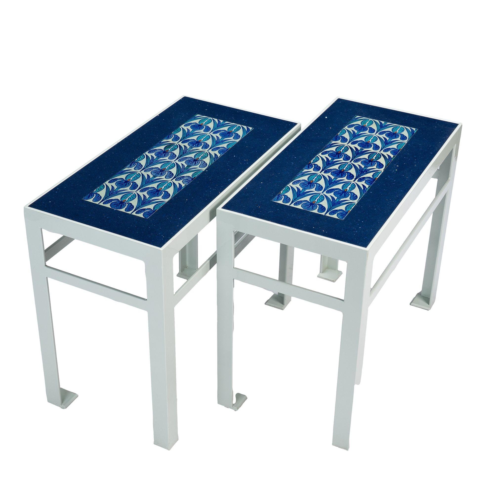 Pair of custom painted iron and framed marble and tile top tables. The blue marble tops are fitted with a set of Maw & Co tiles of an Iris transfer print in an interlocking art nouveau design. Maw & Co was the leading English tile making firm of the