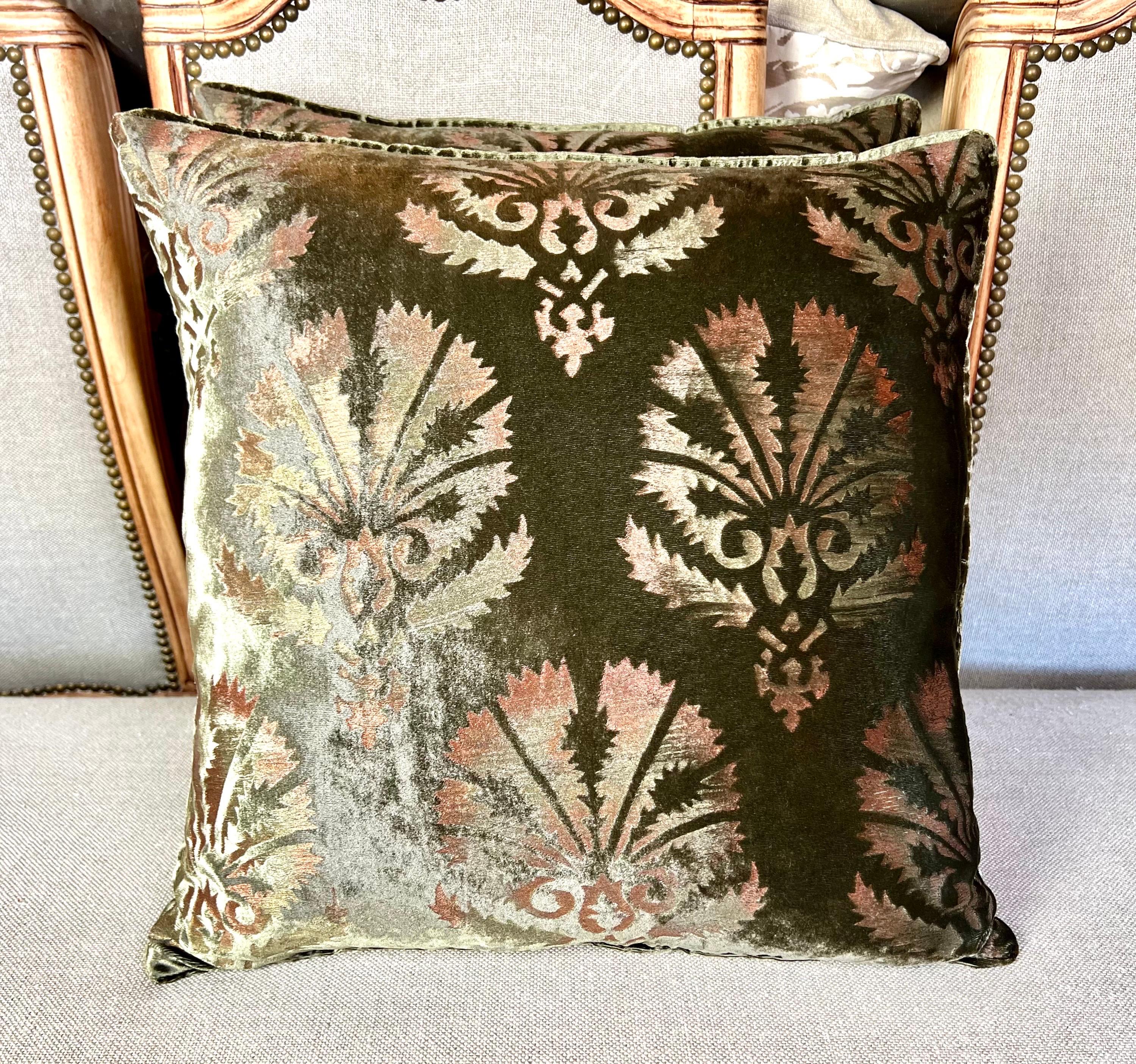 Pair of Custom Nomi Textiles olive green stenciled velvet pillows.  These pillows feature a damask design with delicate stenciling that has touches of pink and yellow on olive green velvet, backed with a coordinating olive green velvet.  The pillows