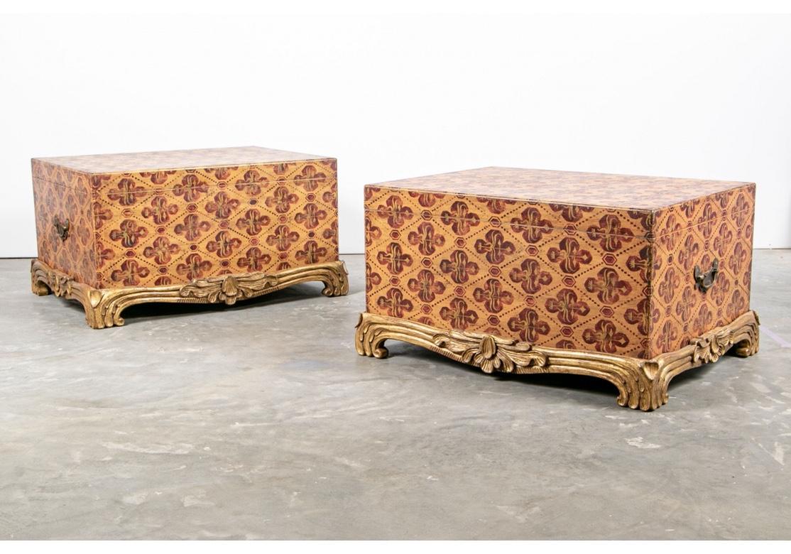 Custom painted by UK artist Graham Carr and signed. His furniture has been featured in Interiors and British House and Garden. Suitable as paired coffee tables.
Each in tan with overall diamond pattern with tan and red cross form motifs. Hinged