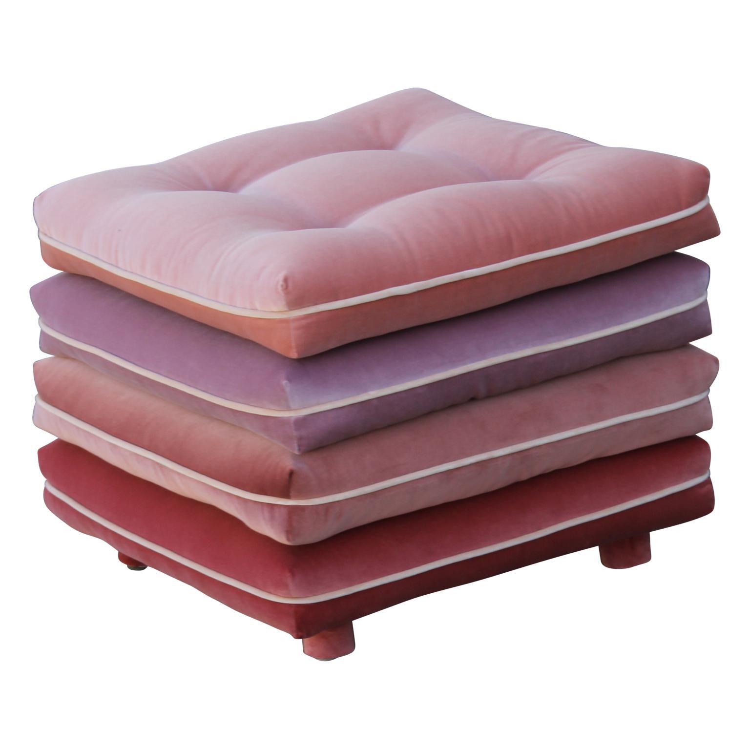 Pair of custom made stacked pillow cushion stools made from four different shades of pink creating a lovely ombre or gradient effect. Outfitted on brass casters. 

We can also make them custom COM.