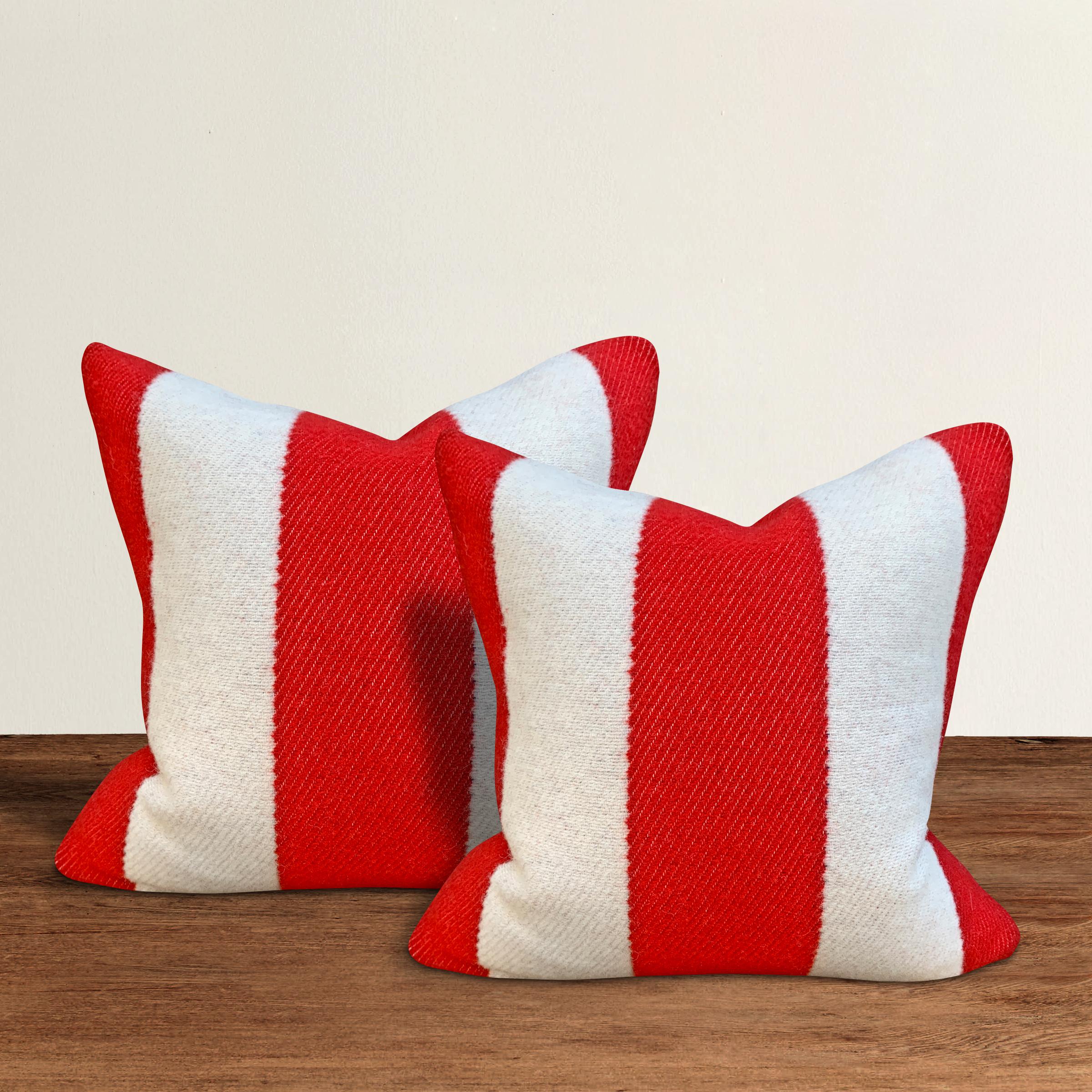 A wonderful pair of pillows with wide red and white stripes on one side, and solid blue on the other, custom made from wool sourced from the Faribault Woolen Mills in Faribault, Minnesota. Faribault Woolen Mills was founded in 1865 along the Cannon