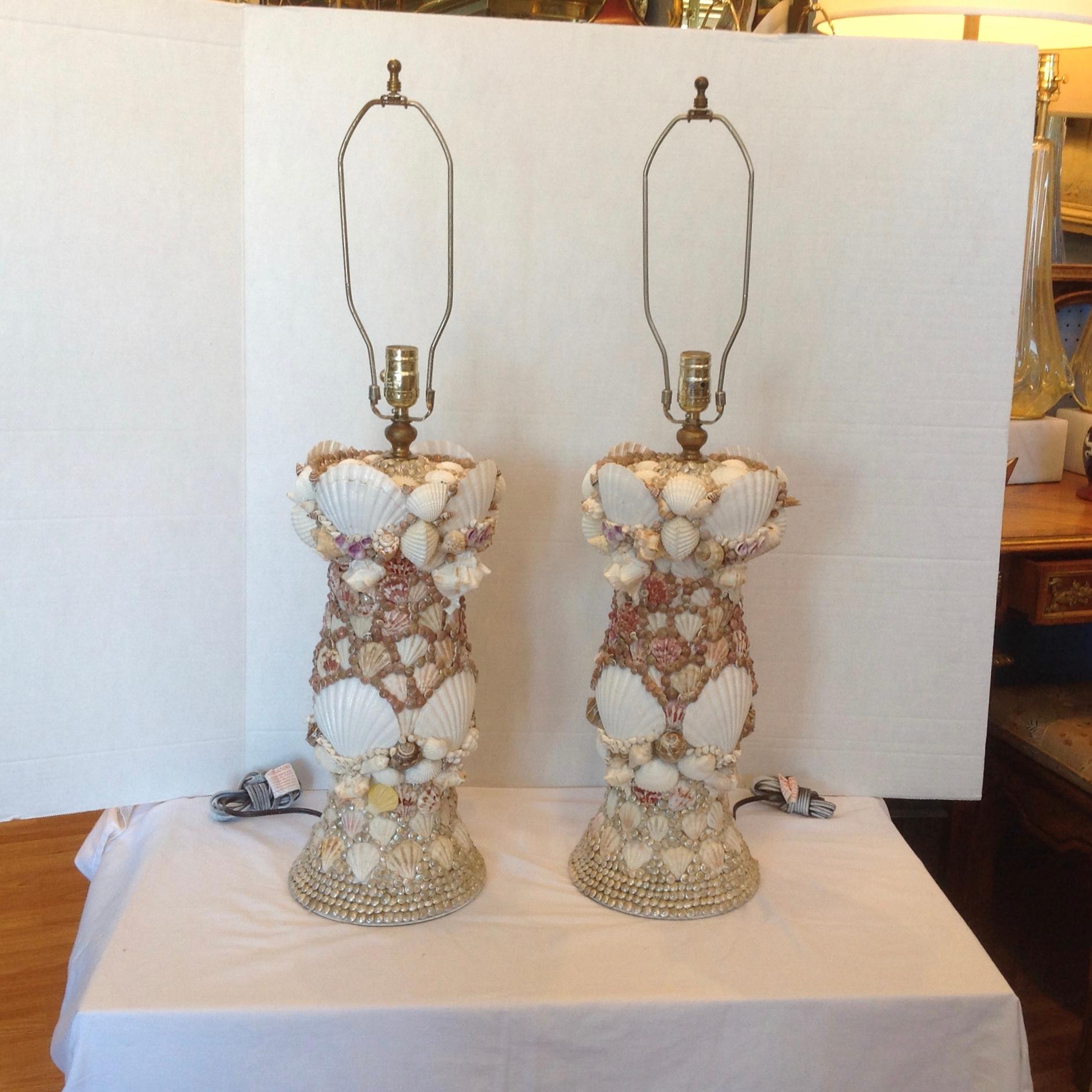 Custom made in the Bahamas for a prominent Palm Beach
residence. The lamps are fashioned with a plethora of shells.
Designed in fashionable cylinder form.
Lamps are measured to top of sockets.