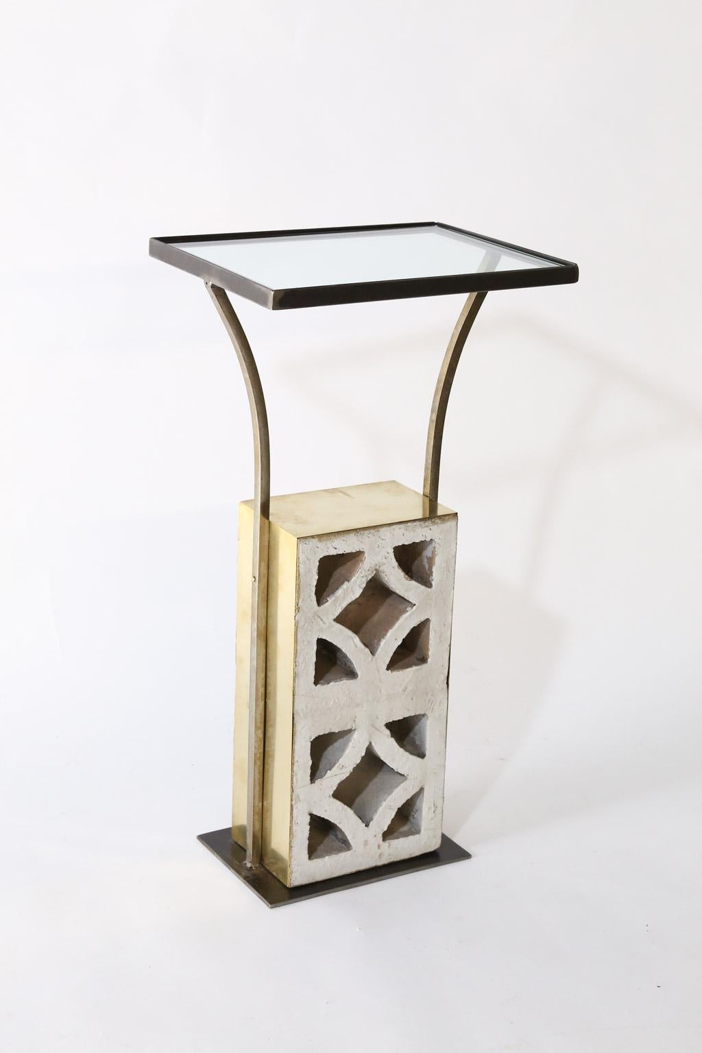 This is a wonderful pair of side tables made from reclaimed midcentury blocks. The concrete blocks were reclaimed from a demolition of a Mid-Century Modern building in Houston, Texas. The blocks are hand wrapped in brass, the frame was hand made