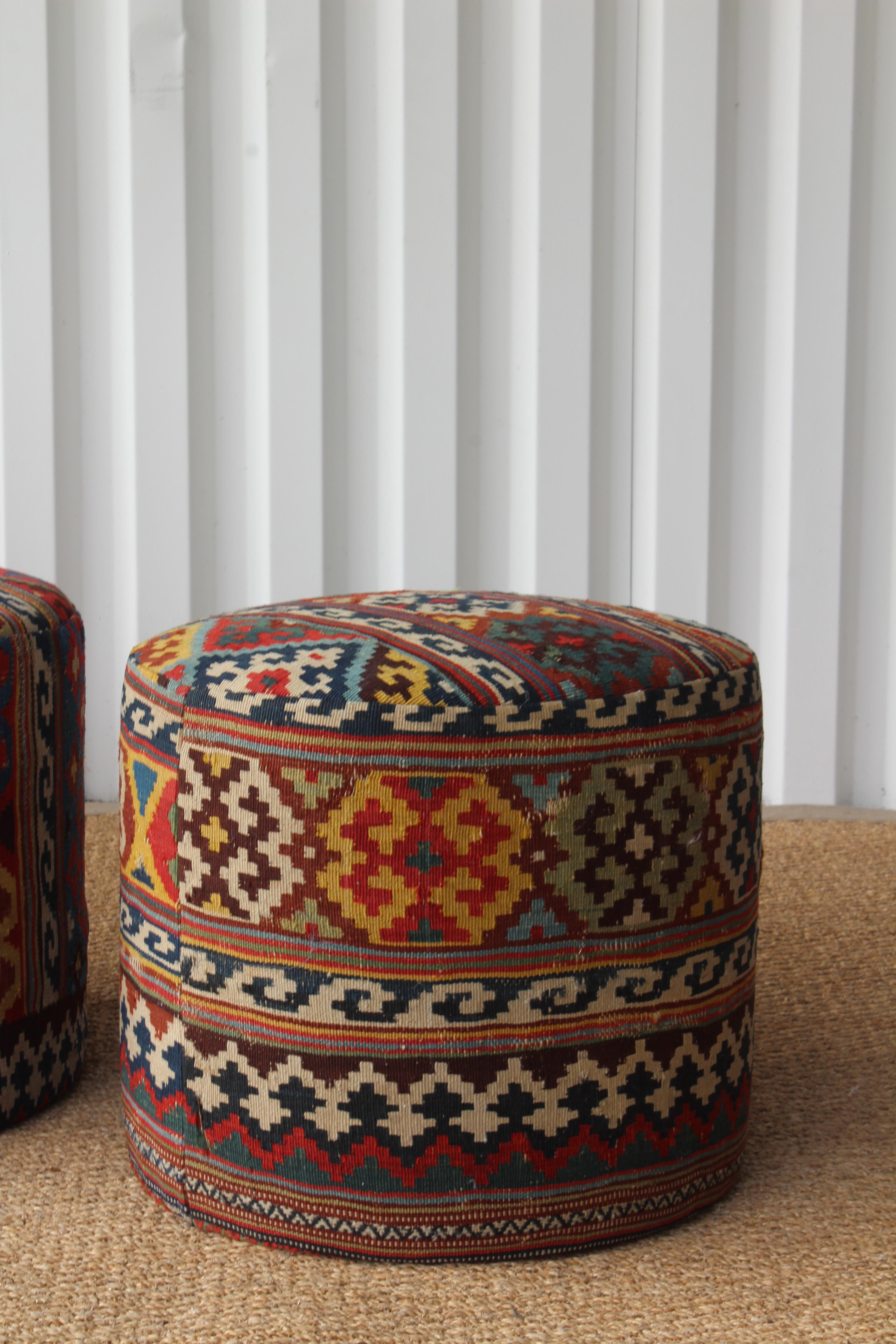 Custom made stools, upholstered in a vintage Turkish Kilim rug. One available. Because we used a vintage rug there is some minimal wear.