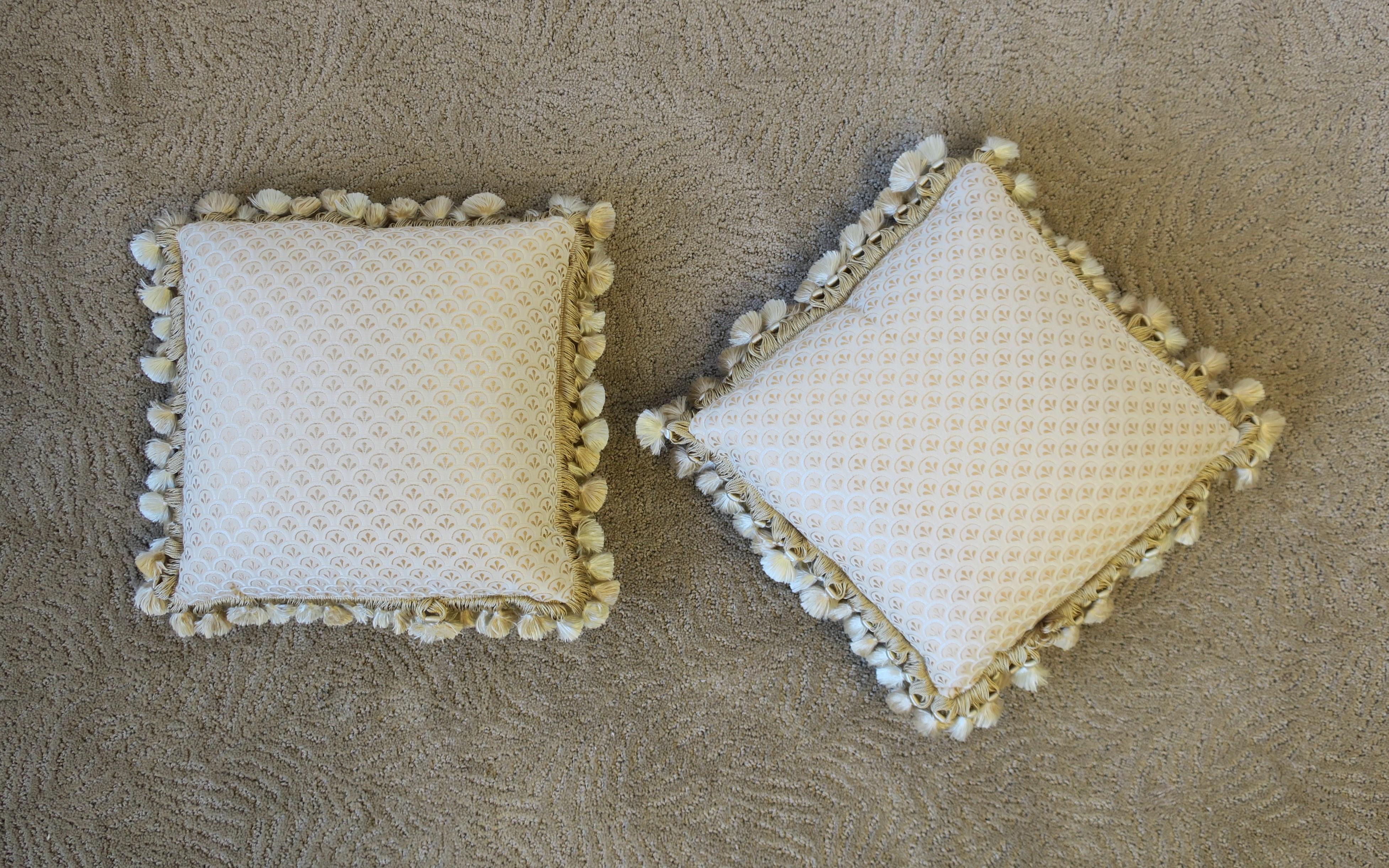 A very beautiful pair of custom upholstered silk accent pillows with fringe and tassels. Pillows are very well made with the best materials. Colors include shades of cream, gold, champagne, and beige/tan (please see image #8 for close-up.)

Each