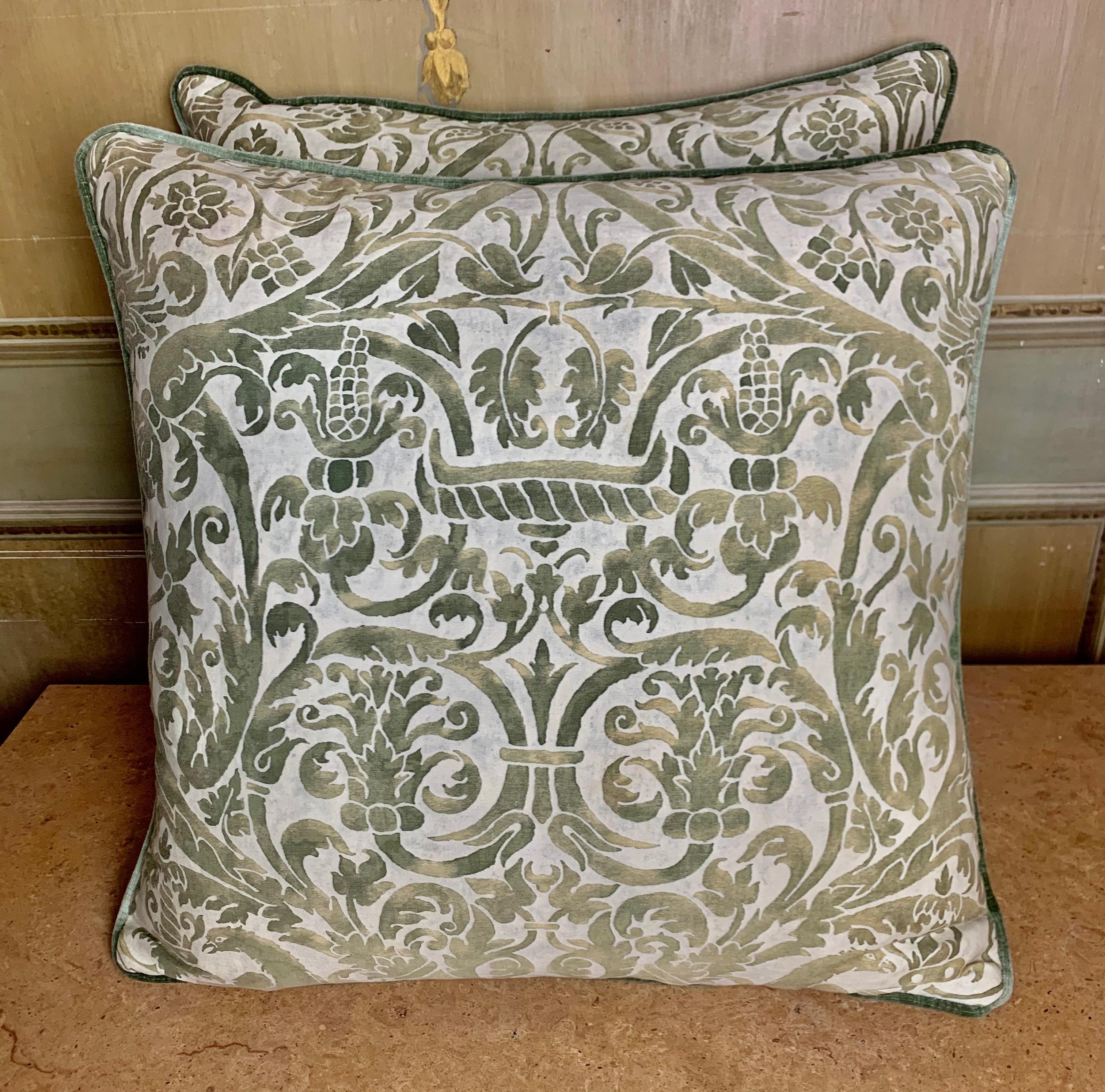 Pair of custom pillows made by Melissa Levinson with authentic green and white Fortuny textile cotton fronts and green velvet backs. Self cording, down inserts, sewn shut.