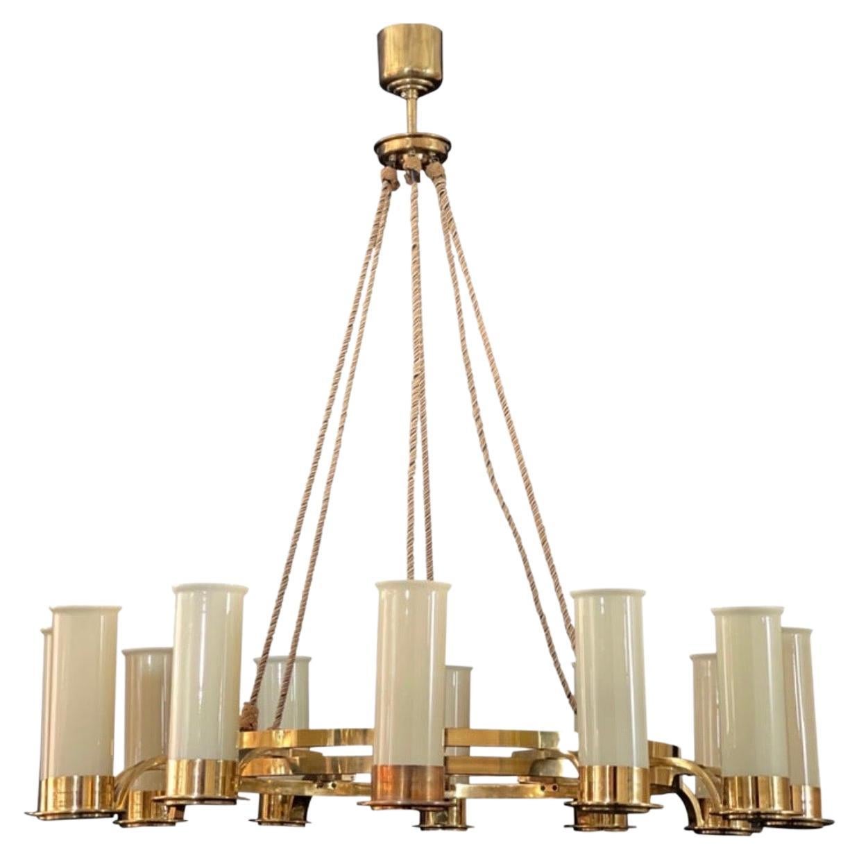 Pair of large customized Art Deco Style brass and glass chandeliers.
Socket: each 16 x E26 for US standards.
