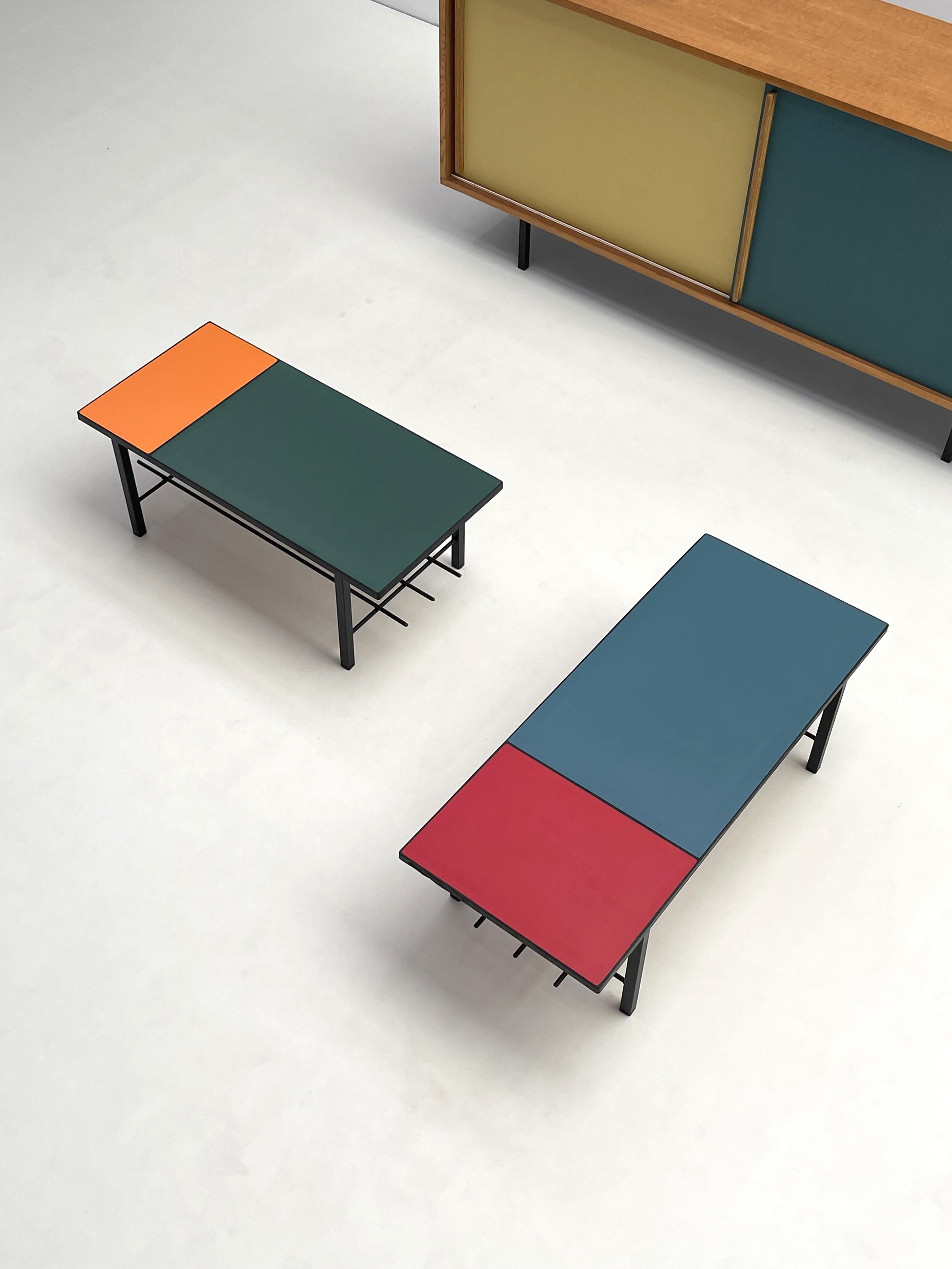 These stylish vintage tables are a perfect example of mid-century modern design, featuring sturdy metal frames and vibrant Formica tops. The durable Formica surface is available in a range of bold, retro colors, adding a playful yet sophisticated