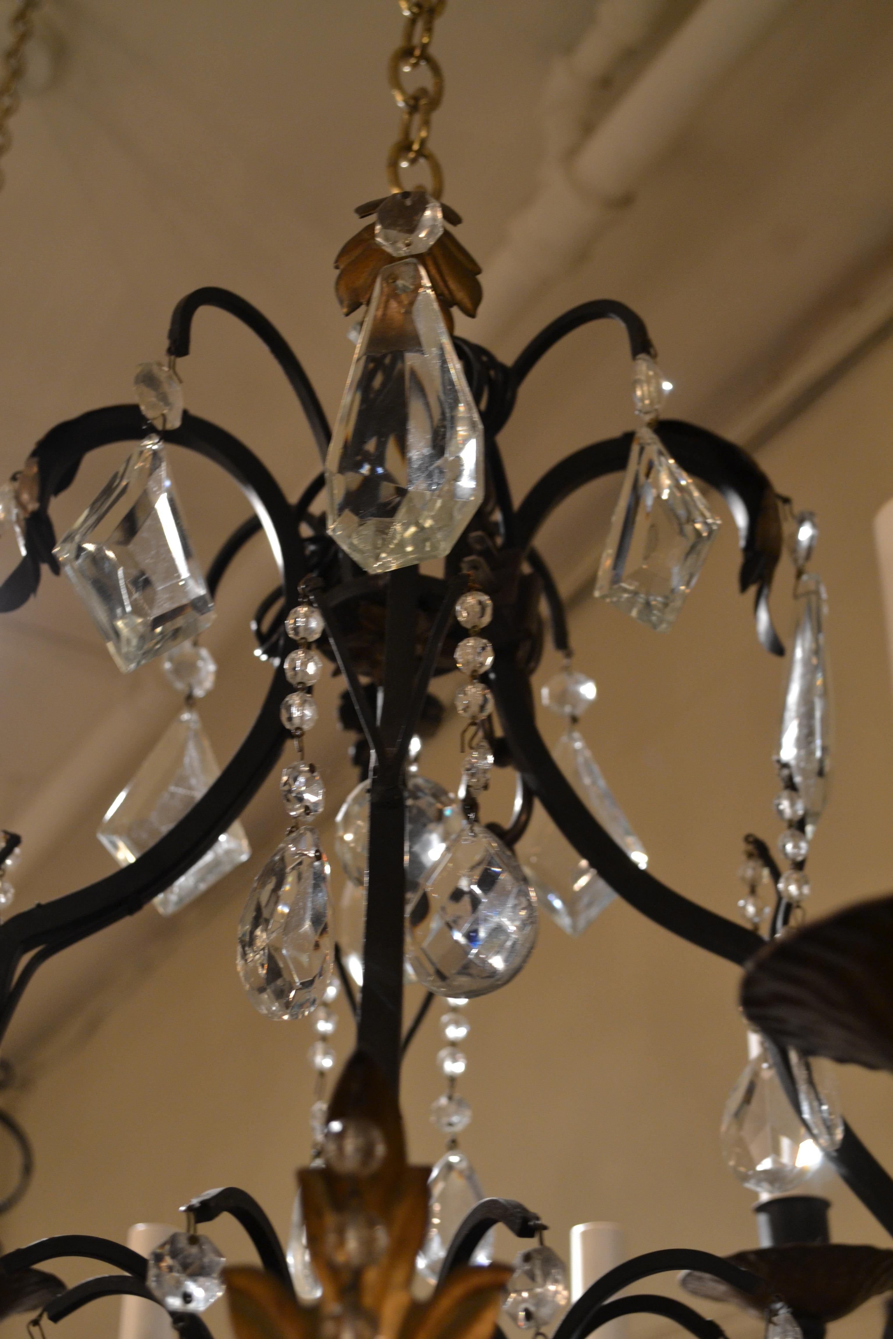 Pair of cut crystal and iron chandelier.