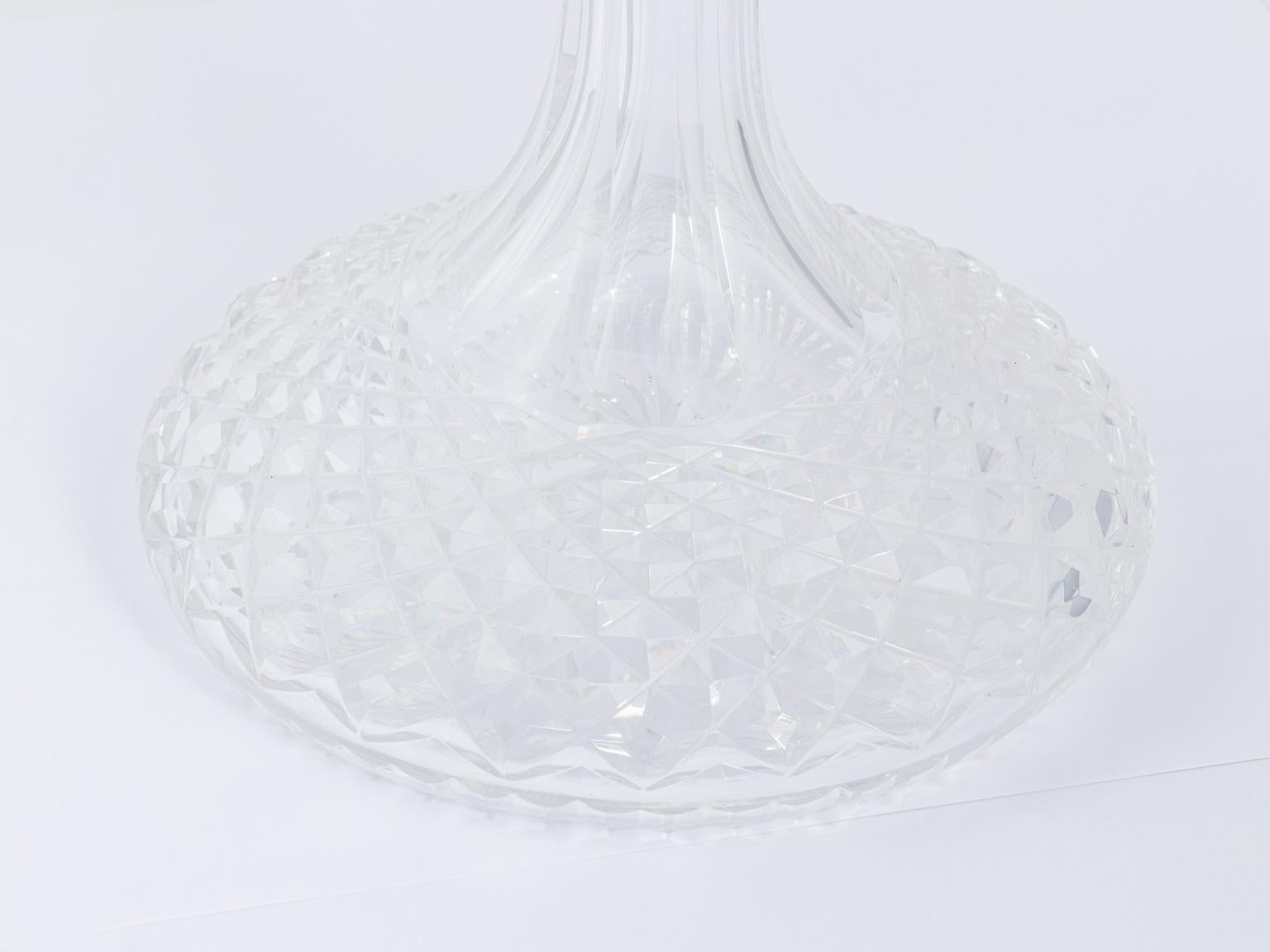 Pair of cut crystal decanters with ball finial stoppers, circa 20th century.
   