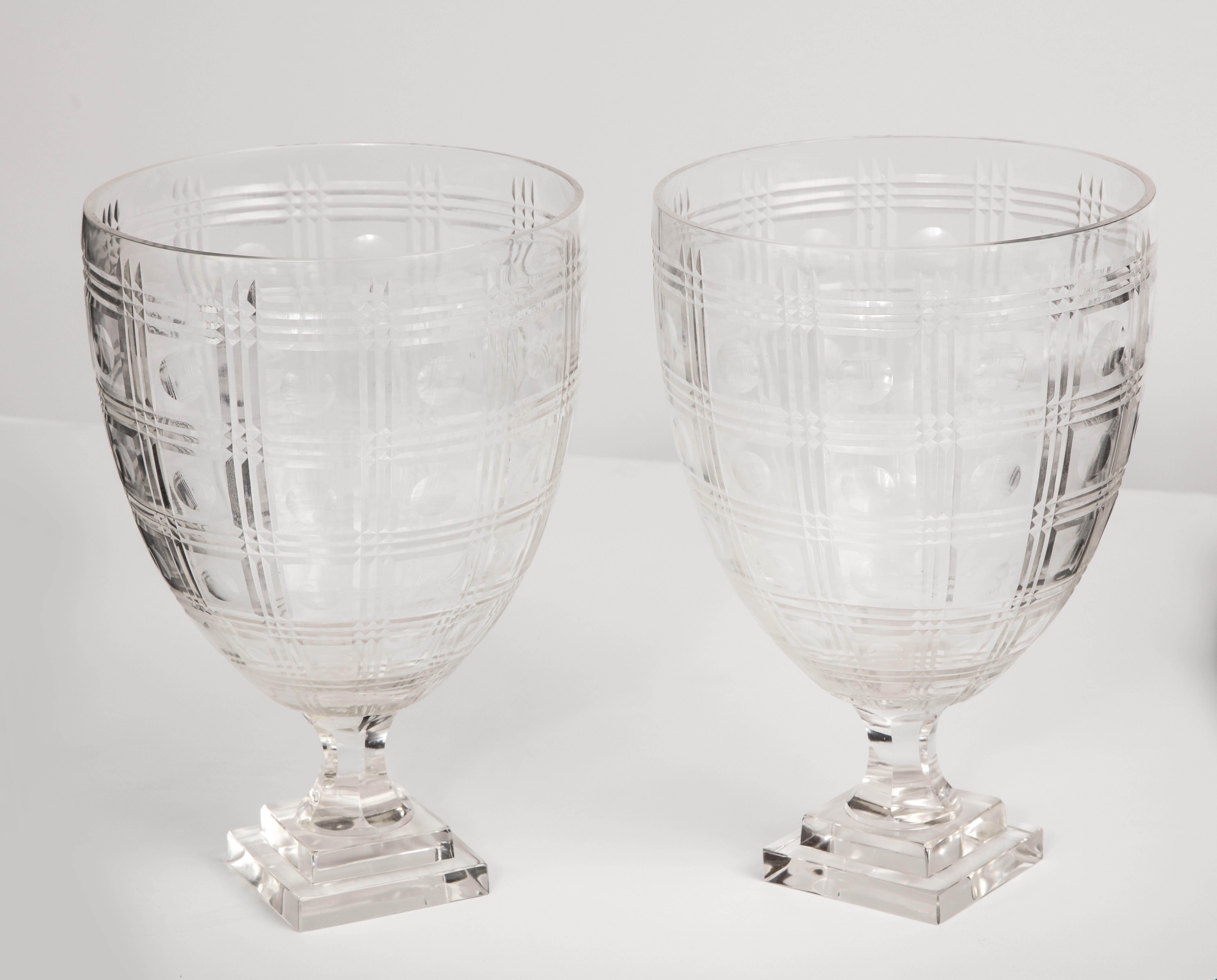Pair of Regency style crystal urns, hand blown with wheelcut decoration.
 