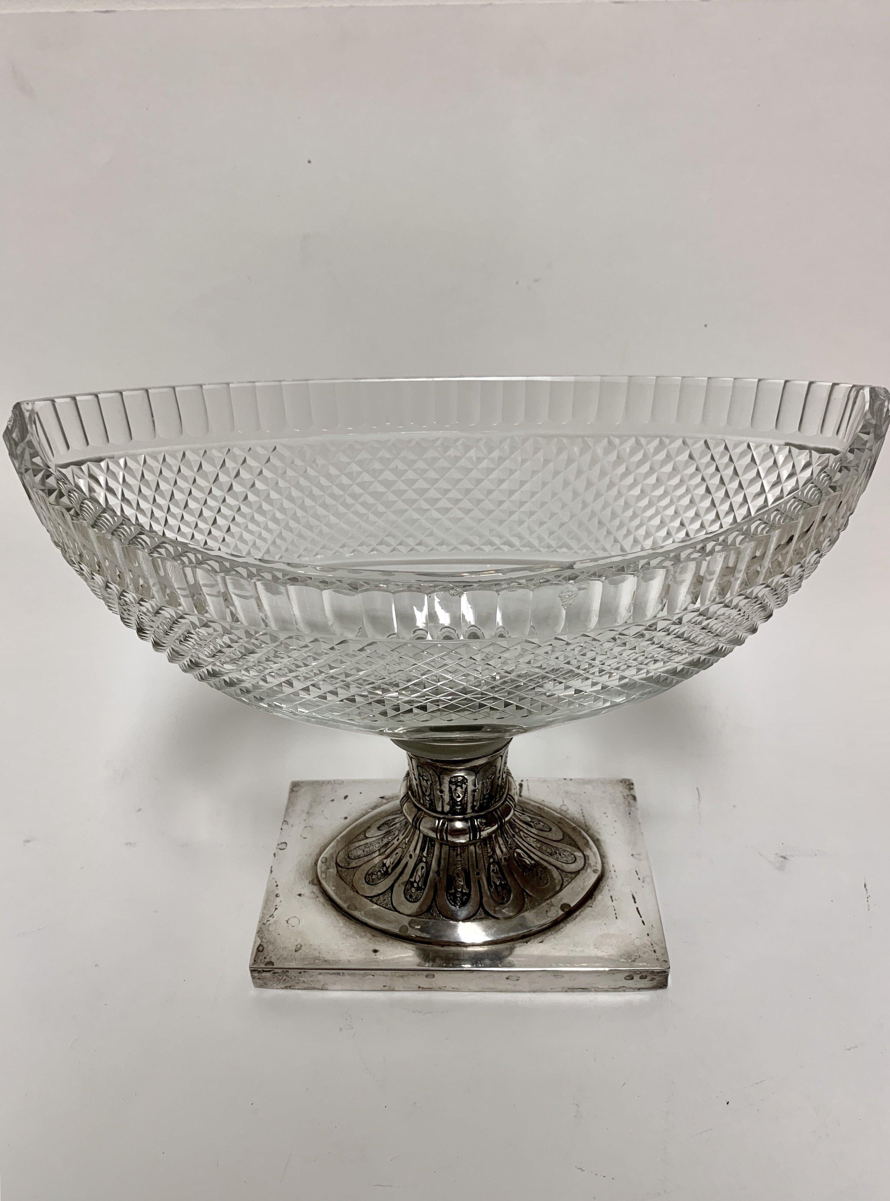 Beautiful pair of cut glass compote bowls on silver pedestal. Brilliant cut glass bowl mounted on a German continental silver pedestal decorated with floral designs. Measuring 9 1/2” in height by 11 1/2” in width by 6 1/2” in depth. Some minor chips