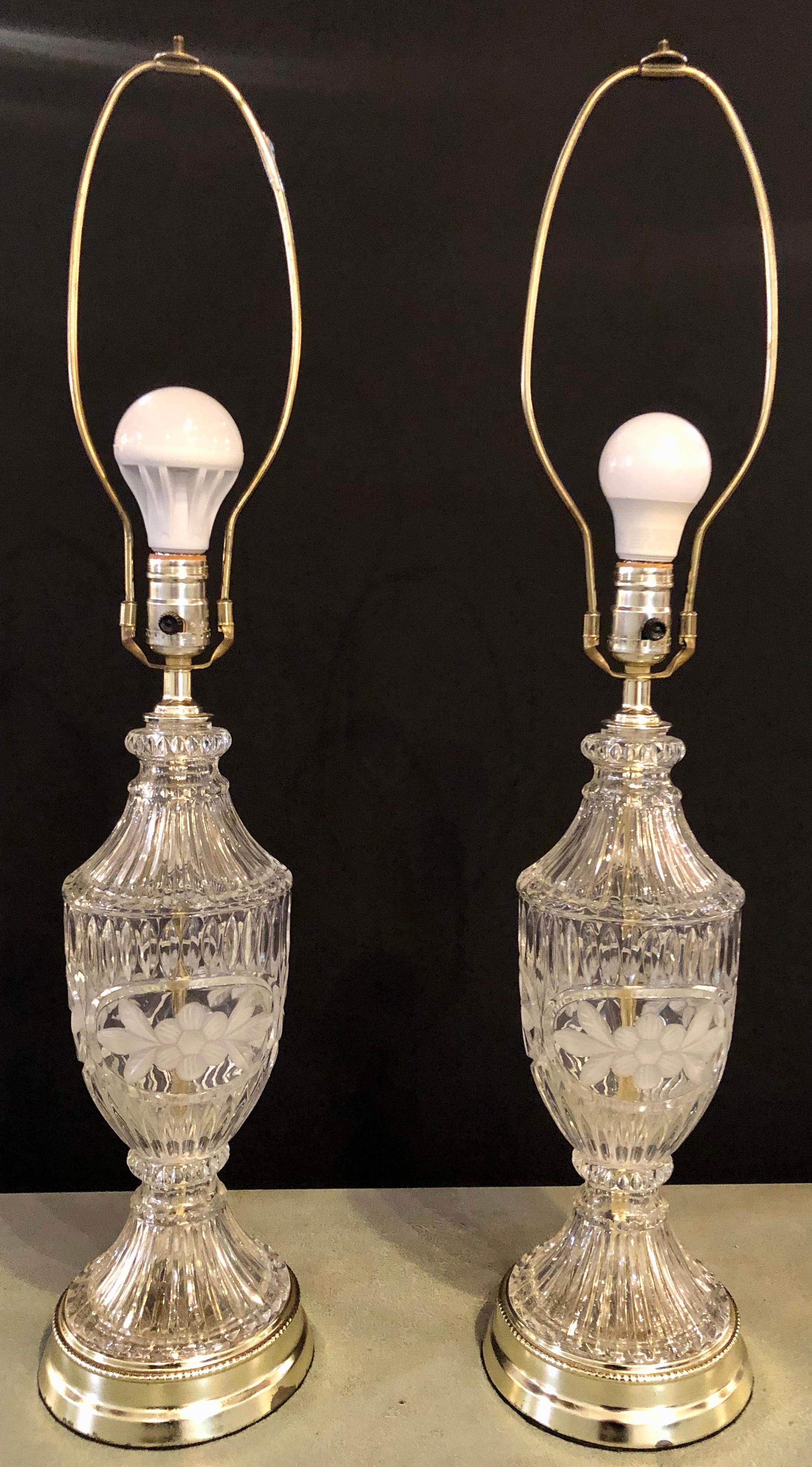 Pair of cut glass lamps having an urn form. Each taking one sixty watt light bulb.