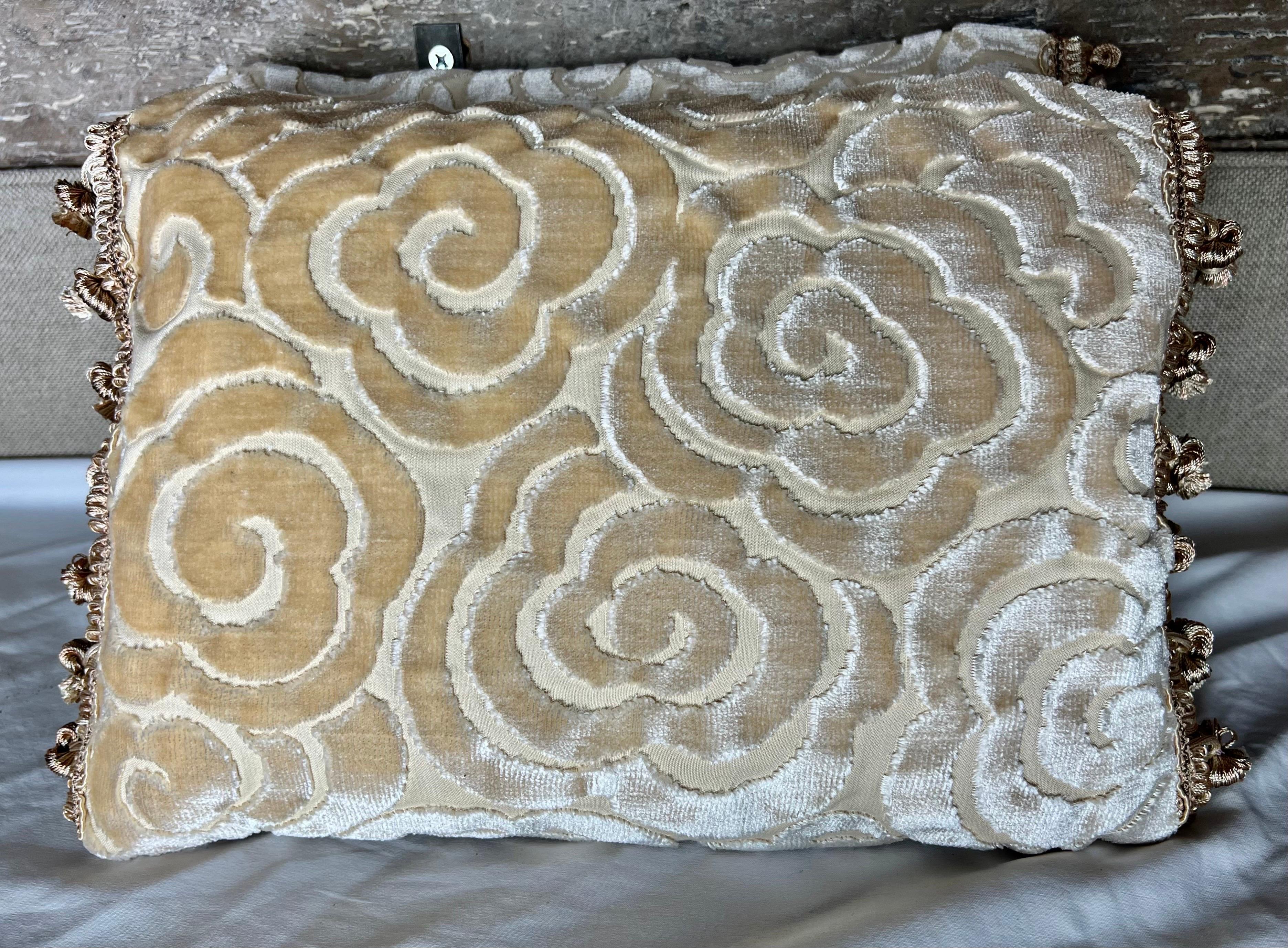 Pair of custom cream colored cut velvet floral patterned pillows with silk backs and cream tassel fringe. Down inserts, zipper closures.