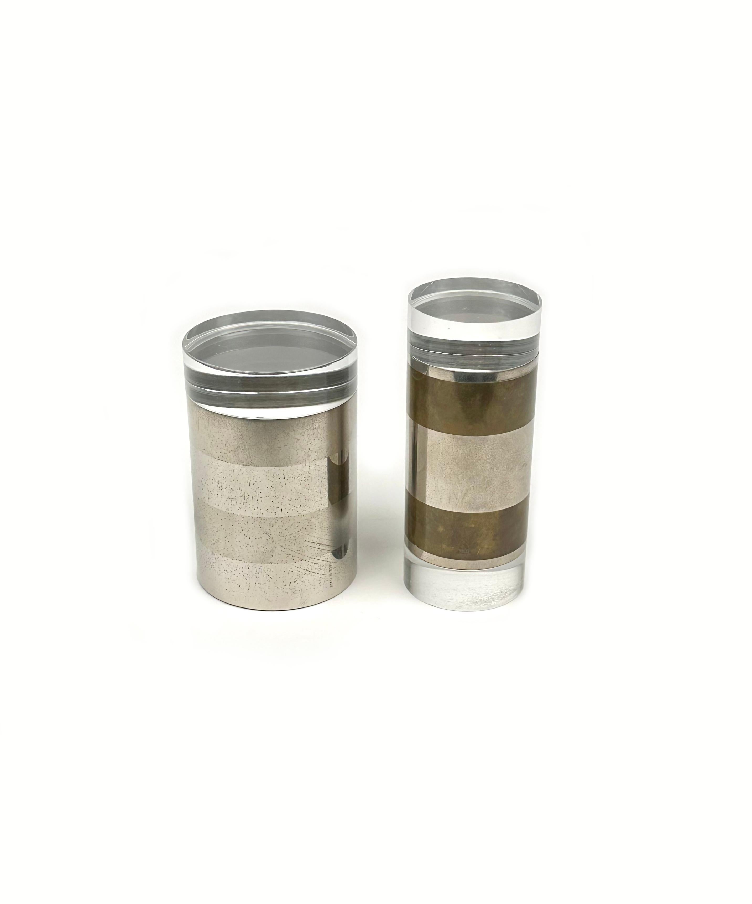 Amazing pair of cylindrical box in chrome, brass and lucite by the Italian designer Romeo Rega.

Made in Italy in the 1970s.

His signature is engraved on the pair of box as shown in photos.

Beautiful desks accessory or pieces for a coffee table or