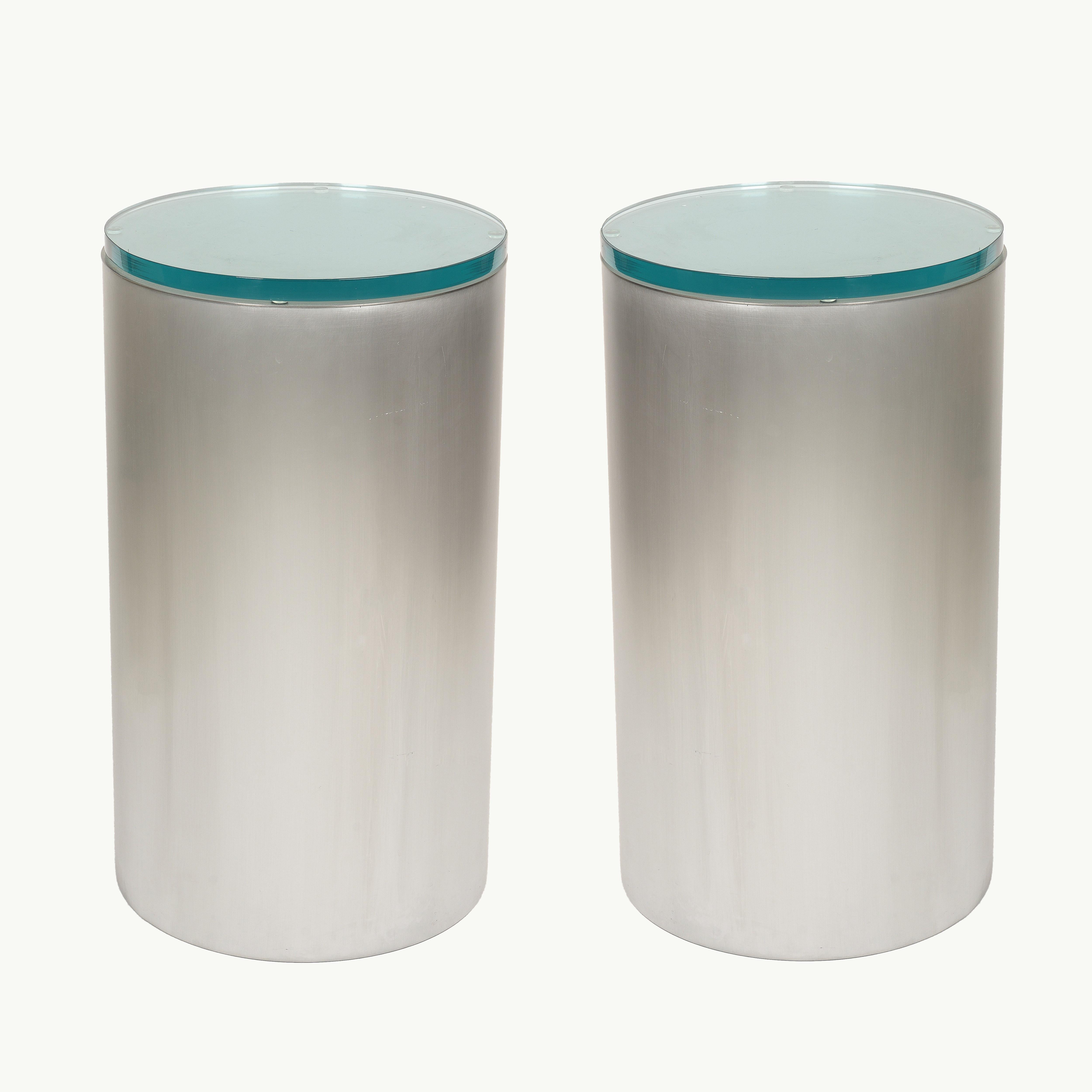 Pair of cylindrical brushed chrome metal and glass end tables For Sale