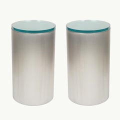 Pair of cylindrical brushed chrome metal and glass end tables