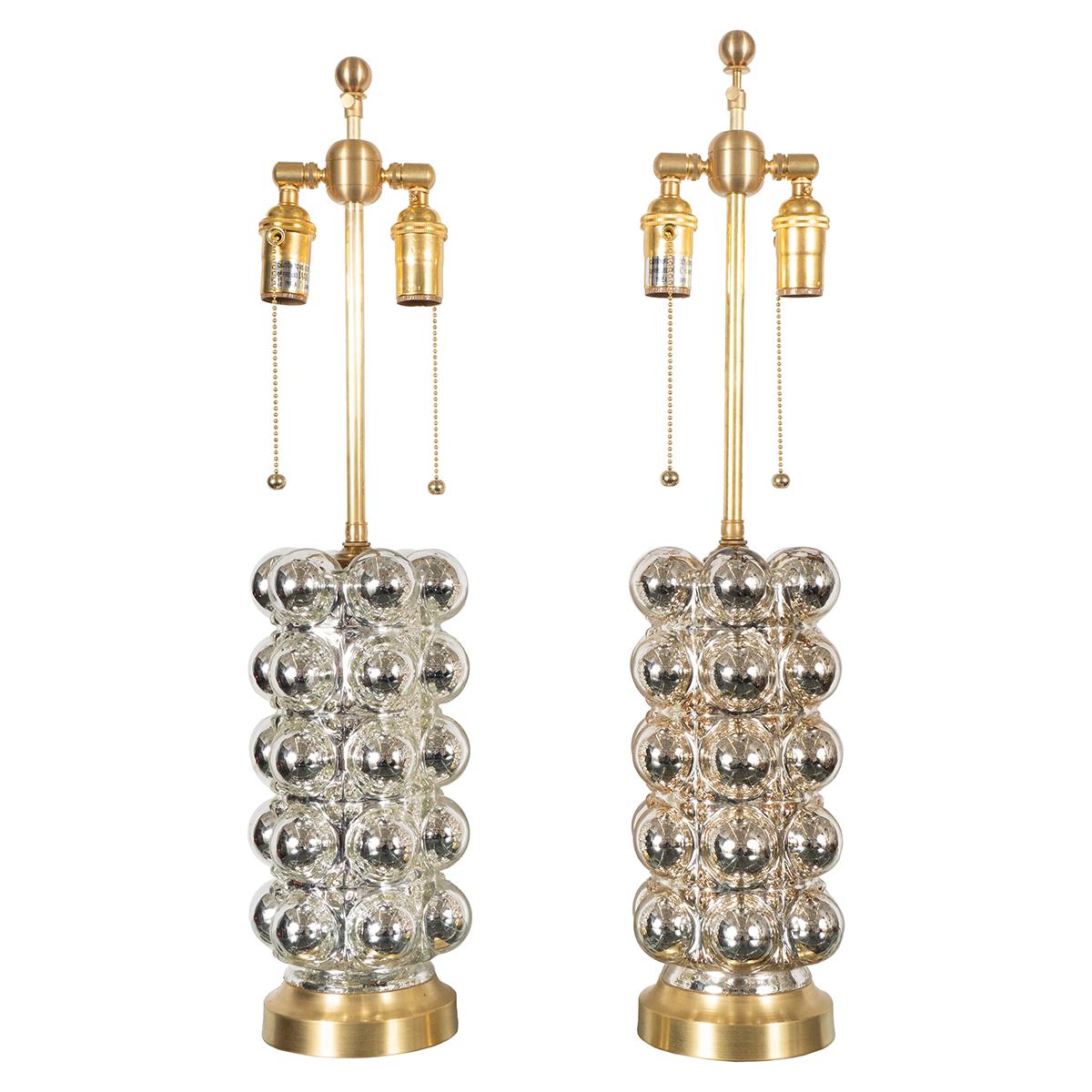 Pair of cylindrical lamps with mercury bubble glass body. Color varies slightly between pairs.