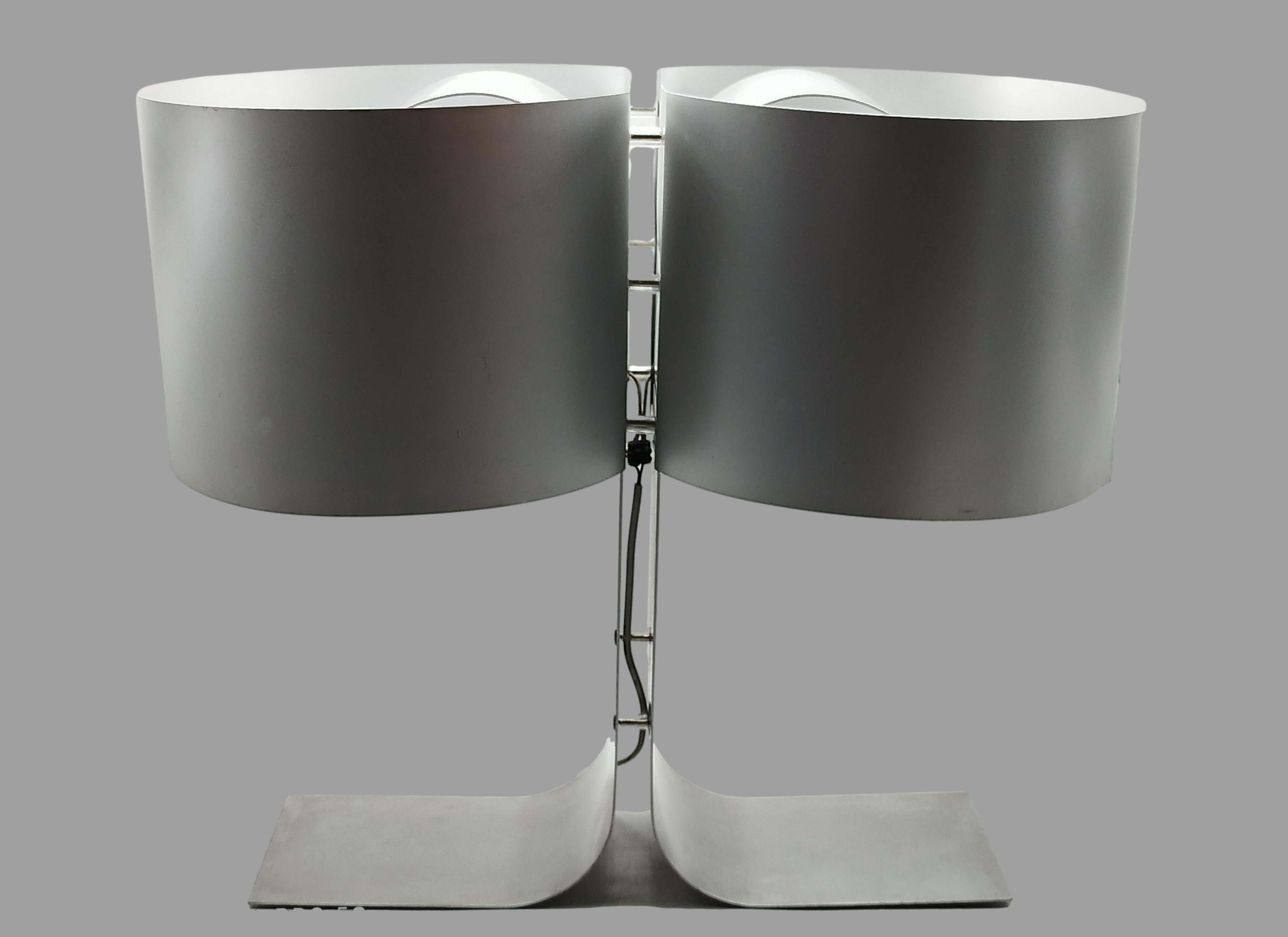  
Brushed metal table lamps, stem formed of joined strips and double cylindrical shade with folded blades.  Produced in France in the 1970s