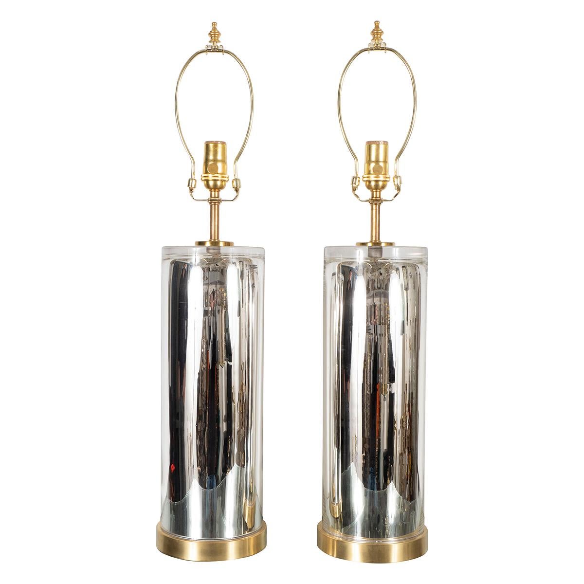 Pair of cylindrical mercury glass table lamps with brass hardware.