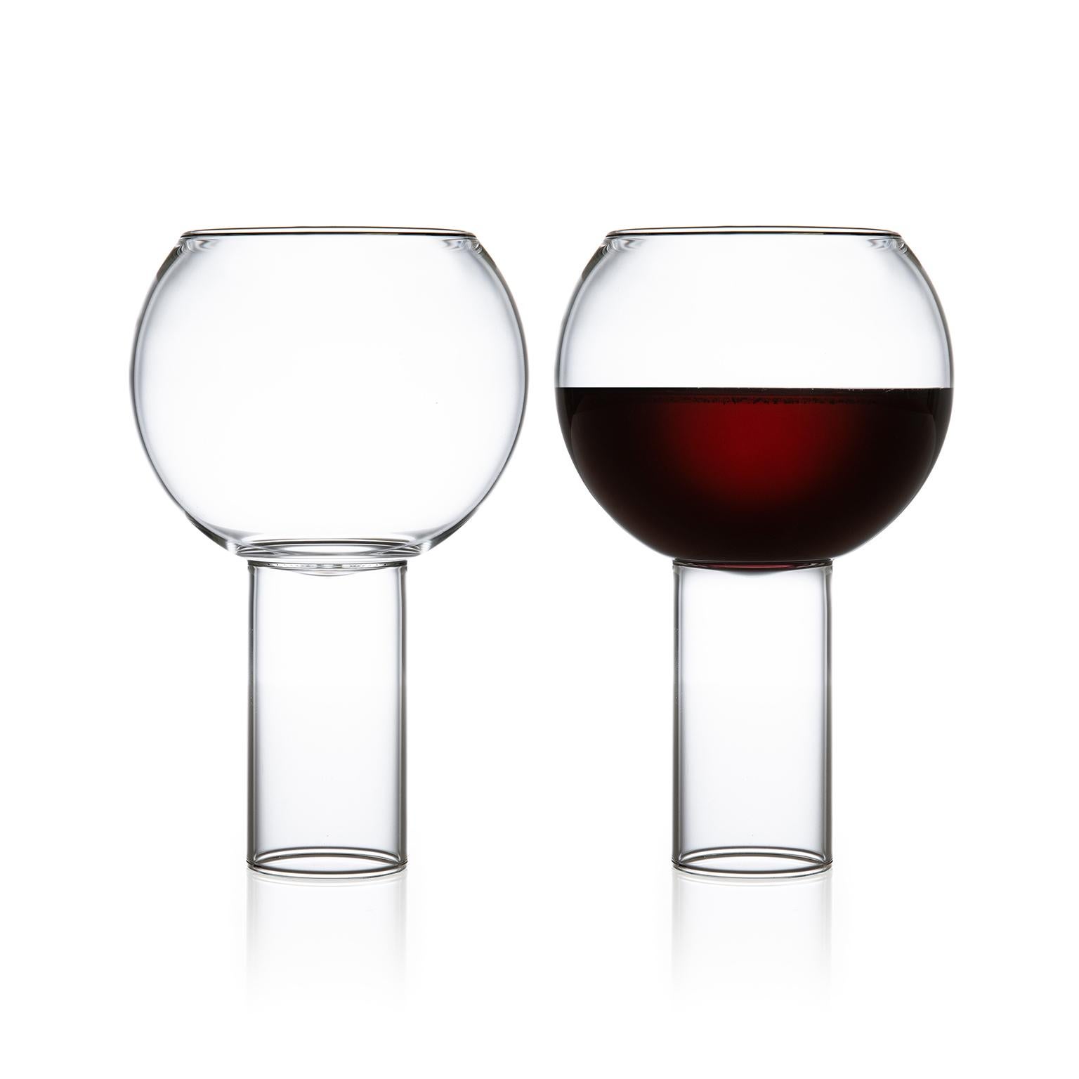 Tulip tall large - set of two.

The Tulip collection was inspired by the small bistro wine glasses found in European bars and cafes. The bowl of the glass sits down into the cylindrical stem, highlighting the intersection between the two. With