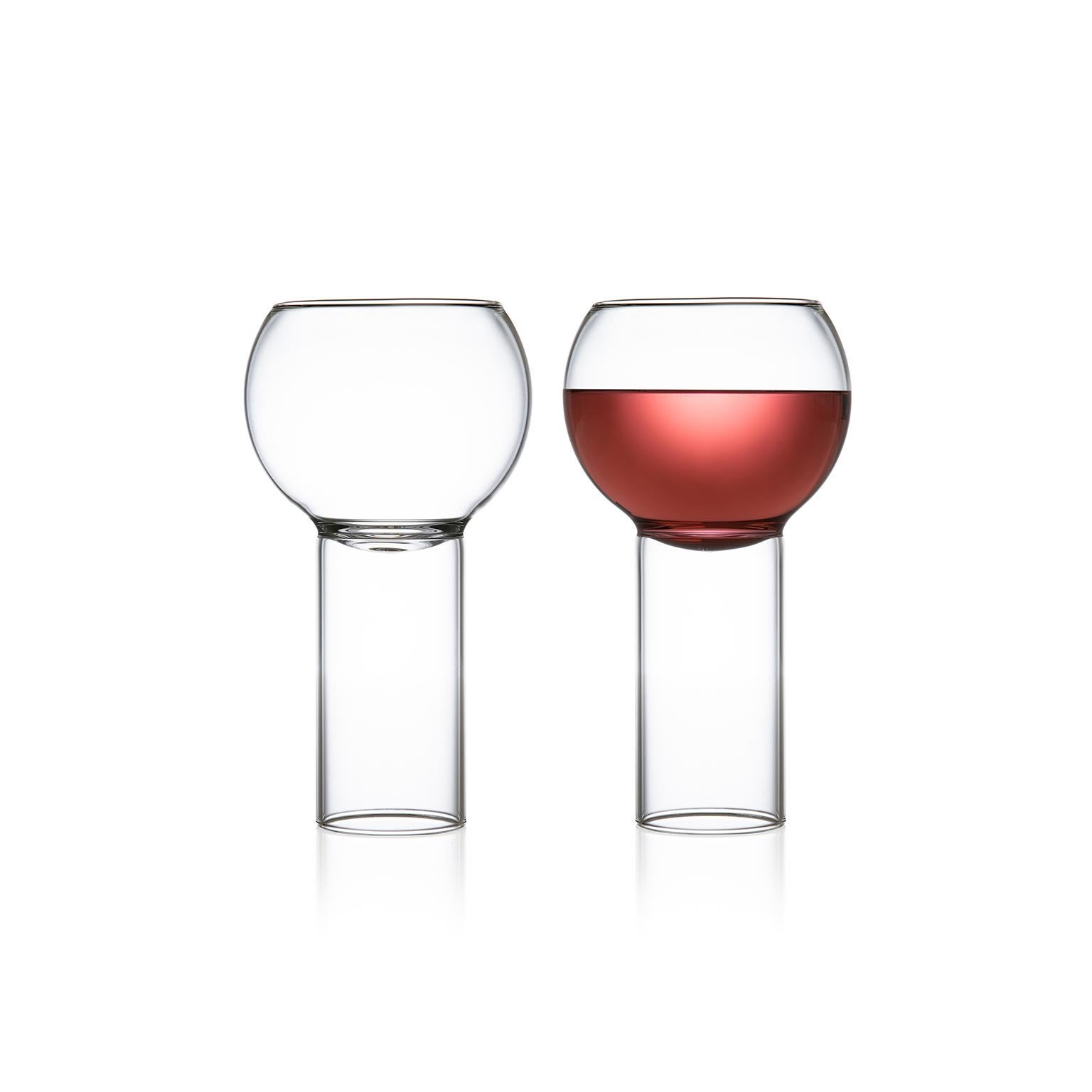 Tulip tall small, set of two.

The Tulip collection was inspired by the small bistro wine glasses found in European bars and cafes. The bowl of the glass sits down into the cylindrical stem, highlighting the intersection between the two. With
